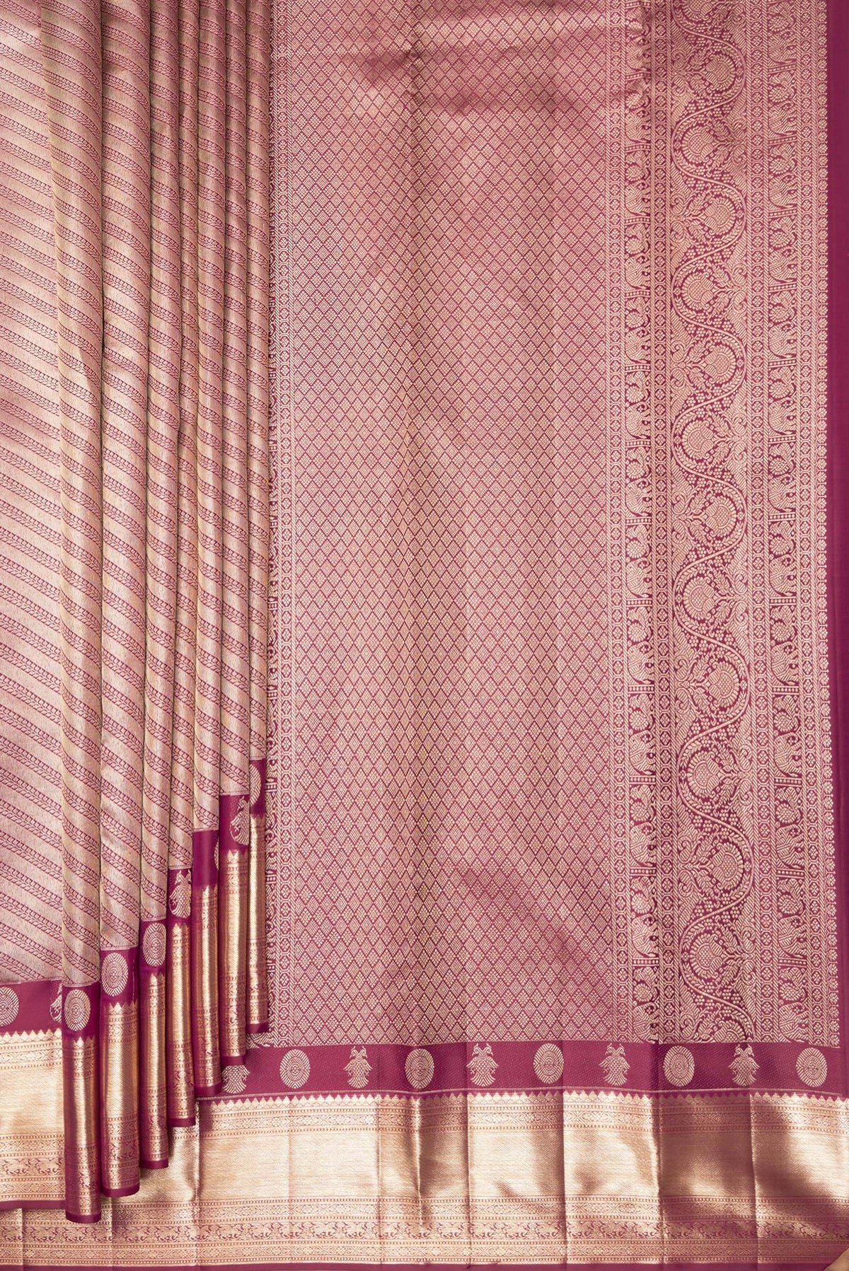 Pleats and pallu of Pure Silk Maroon Kanjivaram Saree with Zari Brocade on the body and Fancy Border. 