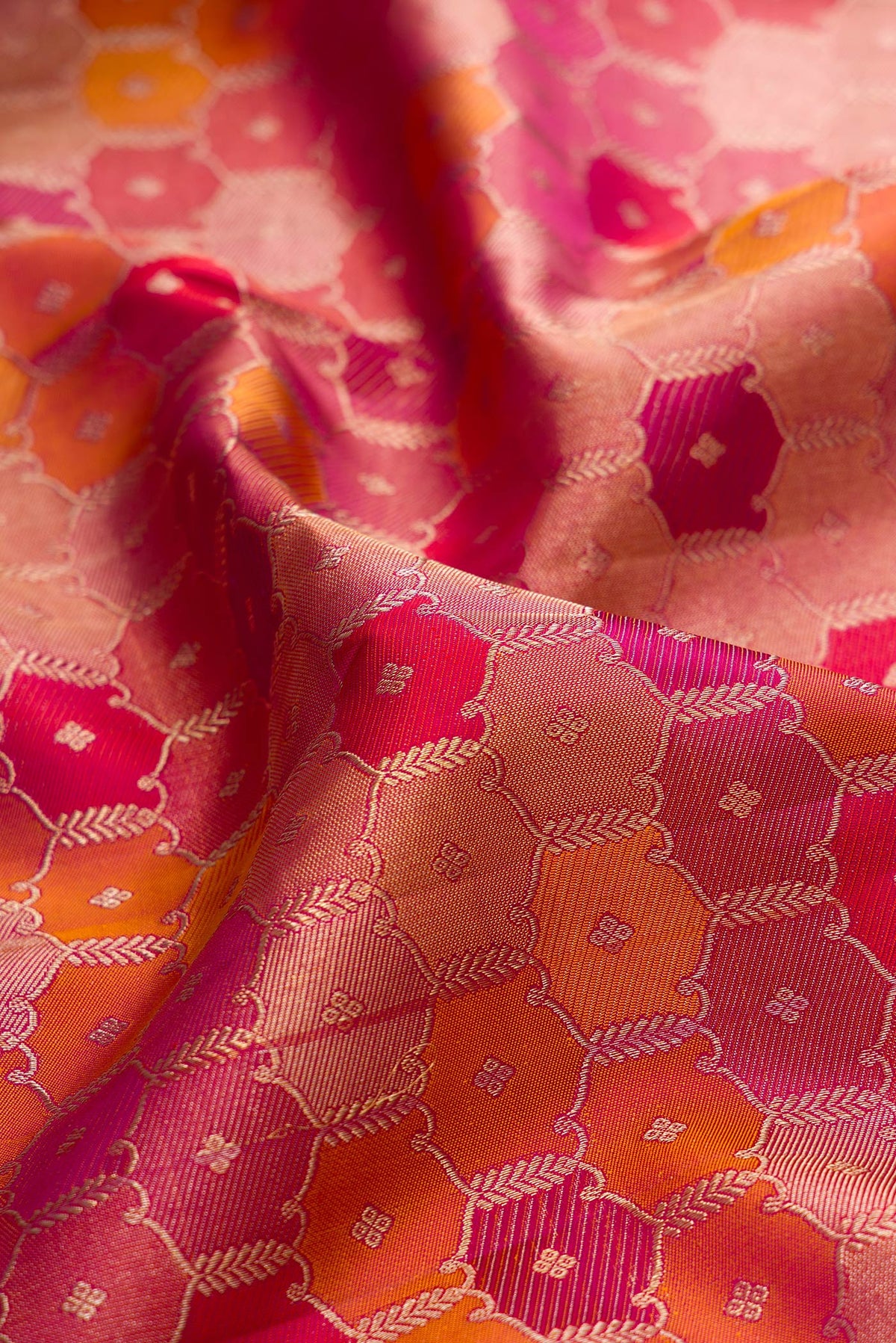 Close up of Pure Silk Magenta Dual Tone Kanjivaram Saree with Zari Brocade on the body and Zari Border.  displaying folds