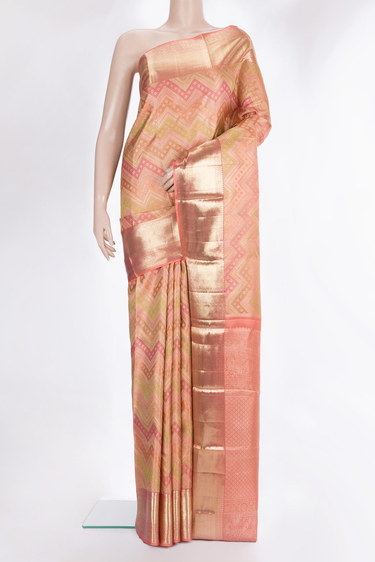 Pure Silk Golden Peach Dual Tone Kanjivaram Saree with Zari Brocade on the body and Zari Border.  displayed on a mannequin