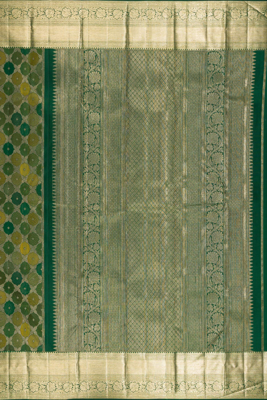 Close up image of the pallu of Pure Silk Bottle Green Kanjivaram Saree with Zari Brocade on the body and Zari Border. 