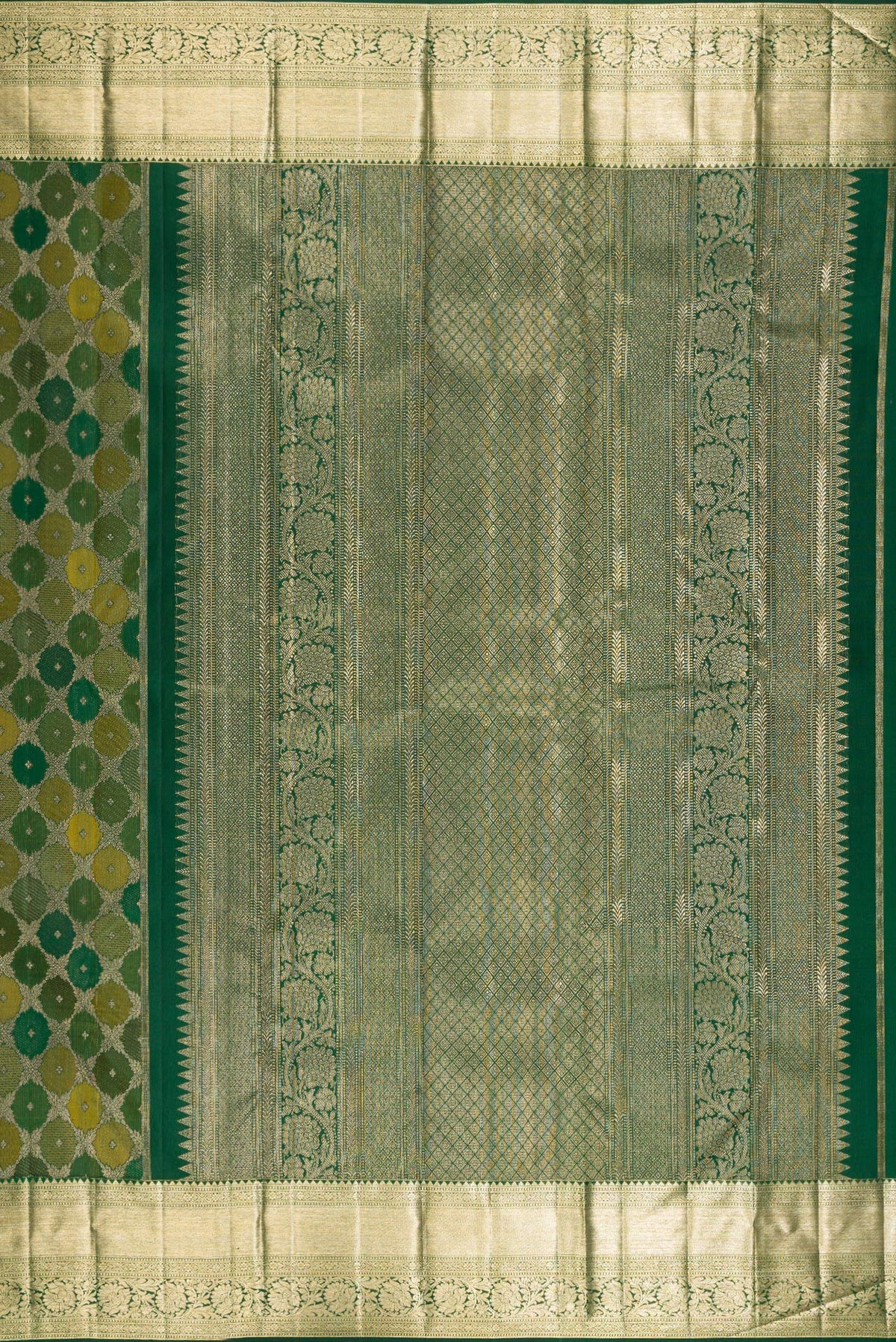 Close up image of the pallu of Pure Silk Bottle Green Kanjivaram Saree with Zari Brocade on the body and Zari Border. 