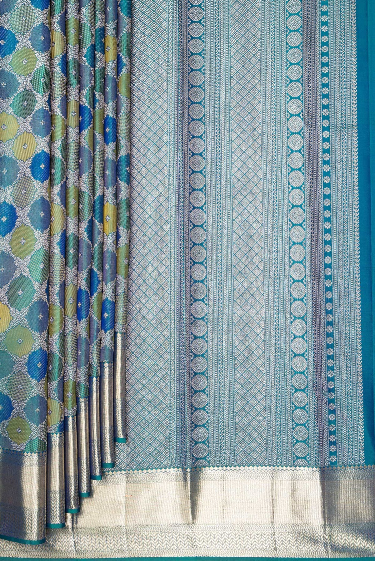 Pleats and pallu of Pure Silk Peacock Blue Dual Tone Kanjivaram Saree with Zari Brocade on the body and Zari Border. 