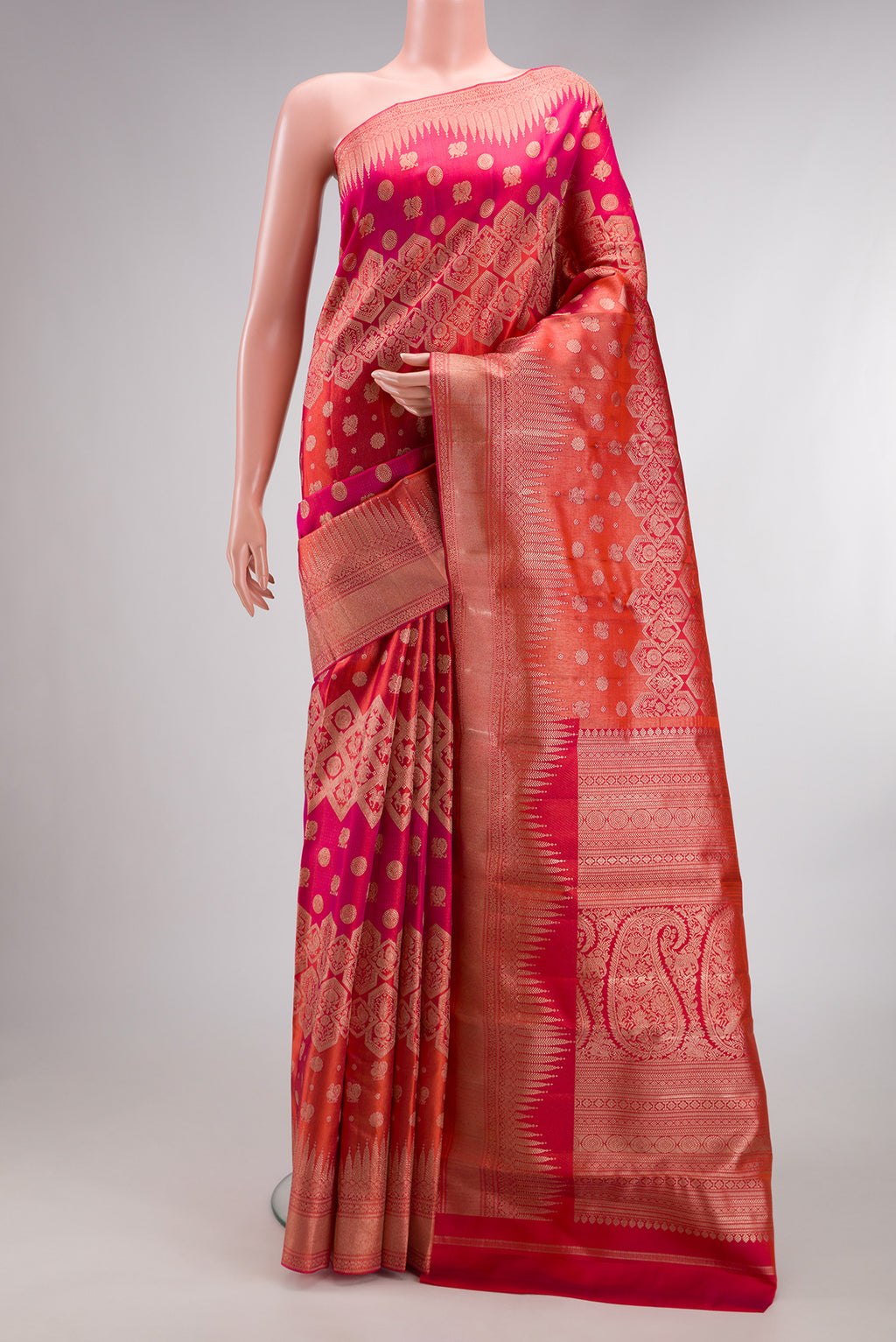 Pure Silk Pink and Orange Color Kanjivaram Saree with Zari Brocade on the body and Fancy Border.  displayed on a mannequin
