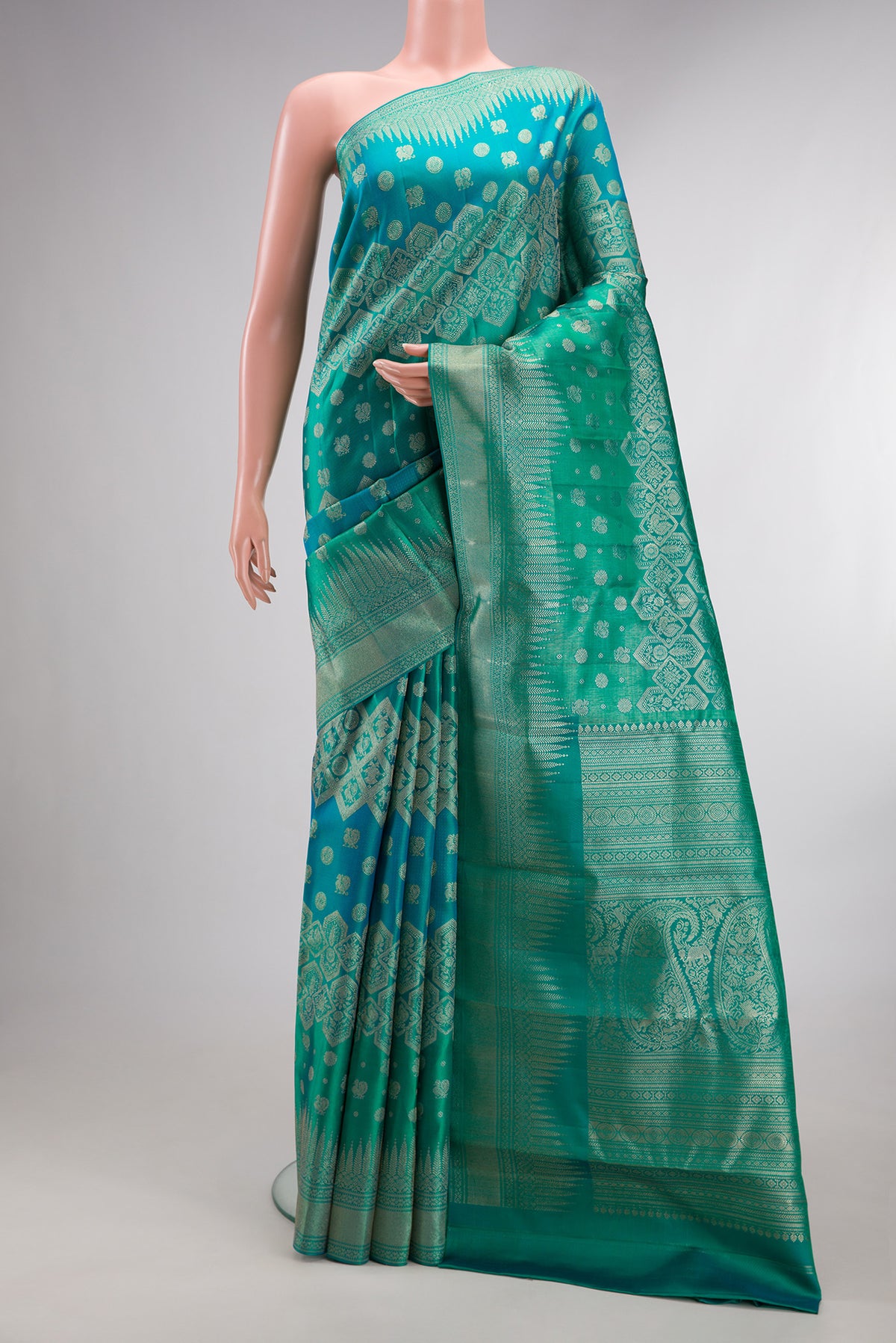 Pure Silk Blue and Sea Green Color Kanjivaram Saree with Zari Brocade on the body and Fancy Border.  displayed on a mannequin