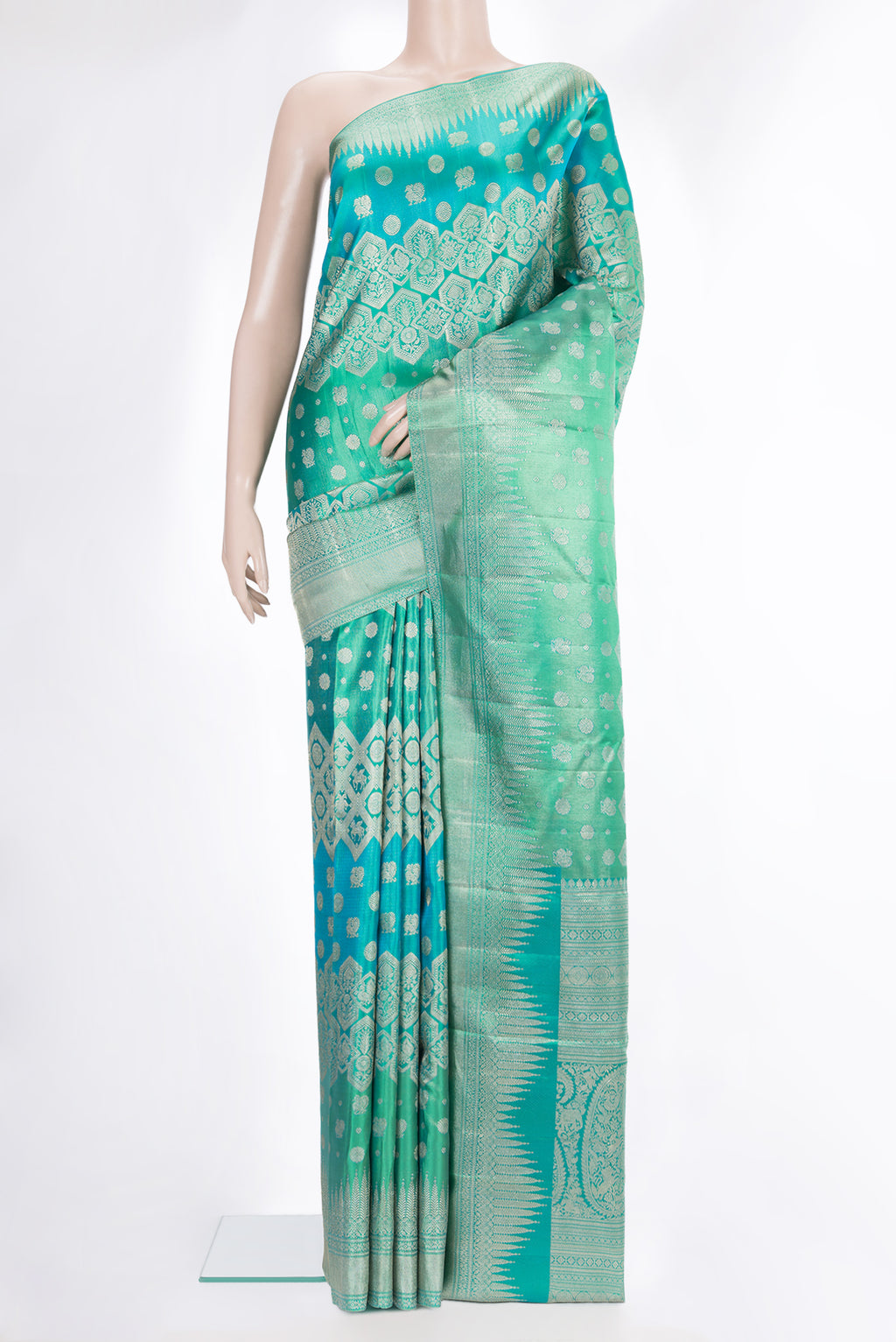 Pure Silk Sea Green Dual Tone Kanjivaram Saree with Zari Brocade on the body and Fancy Border.  displayed on a mannequin