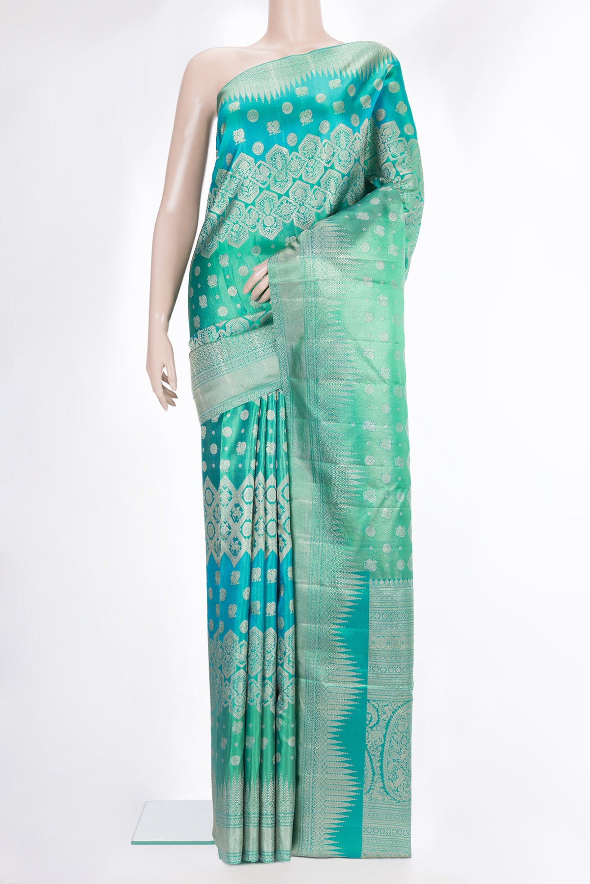 Pure Silk Sea Green Dual Tone Kanjivaram Saree with Zari Brocade on the body and Fancy Border.  displayed on a mannequin