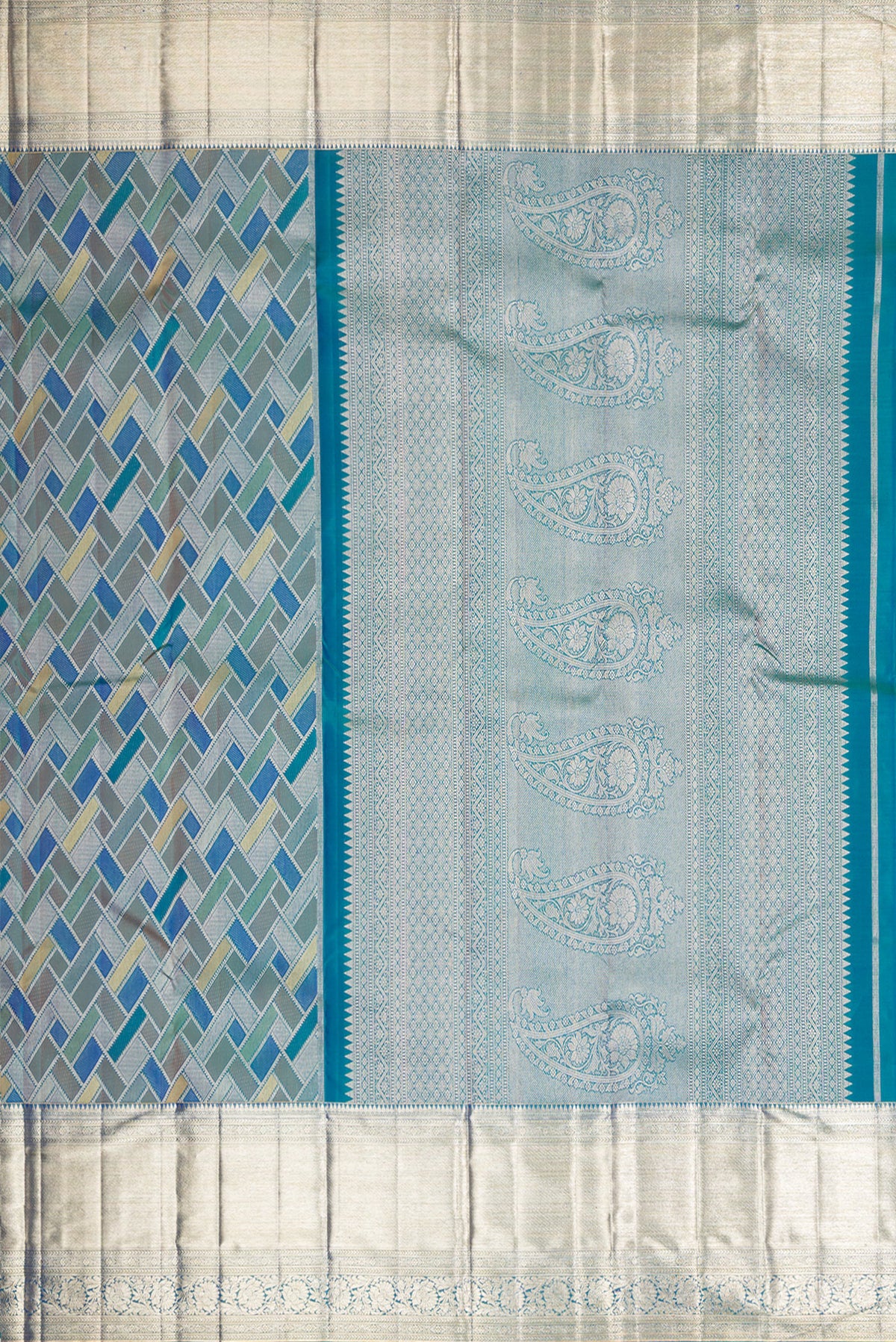 Close up image of the pallu of Pure Silk Peacock Blue Dual Tone Kanjivaram Saree with Zari Brocade on the body and Zari Border. 