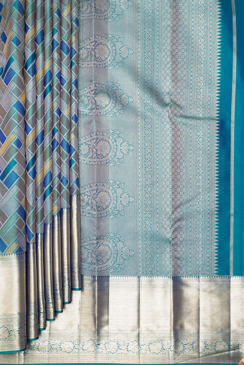Pleats and pallu of Pure Silk Peacock Blue Dual Tone Kanjivaram Saree with Zari Brocade on the body and Zari Border. 