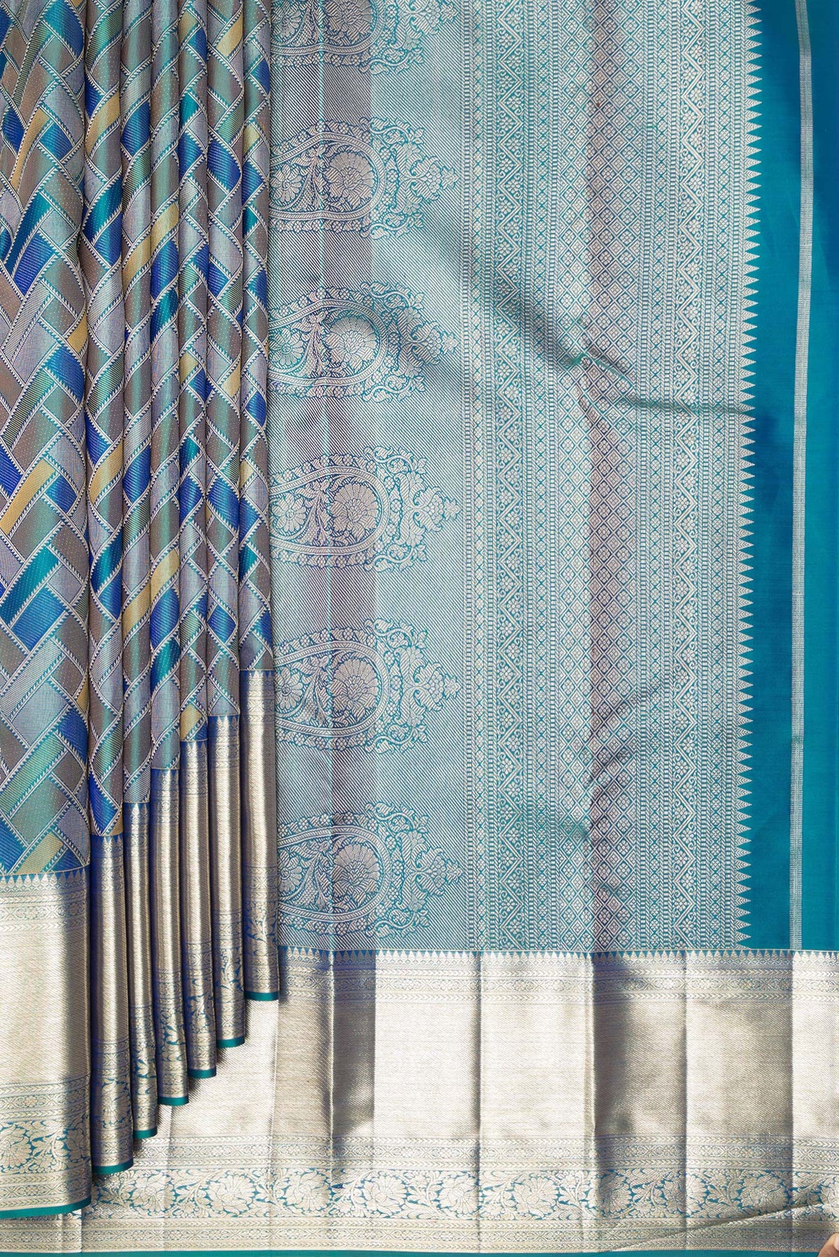 Pleats and pallu of Pure Silk Peacock Blue Dual Tone Kanjivaram Saree with Zari Brocade on the body and Zari Border. 