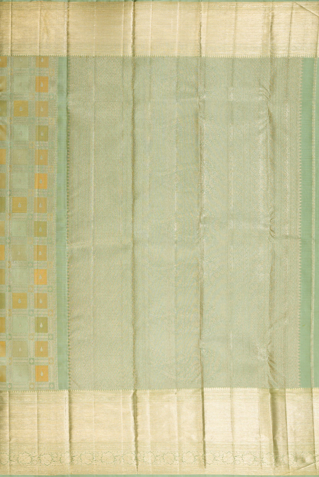 Close up image of the pallu of Pure Silk Pista Green Kanjivaram Saree with Zari Brocade on the body and Zari Border. 