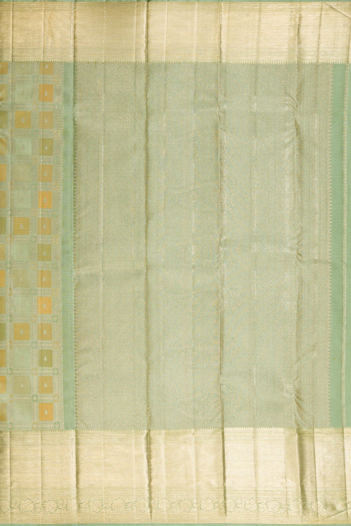 Close up image of the pallu of Pure Silk Pista Green Kanjivaram Saree with Zari Brocade on the body and Zari Border. 