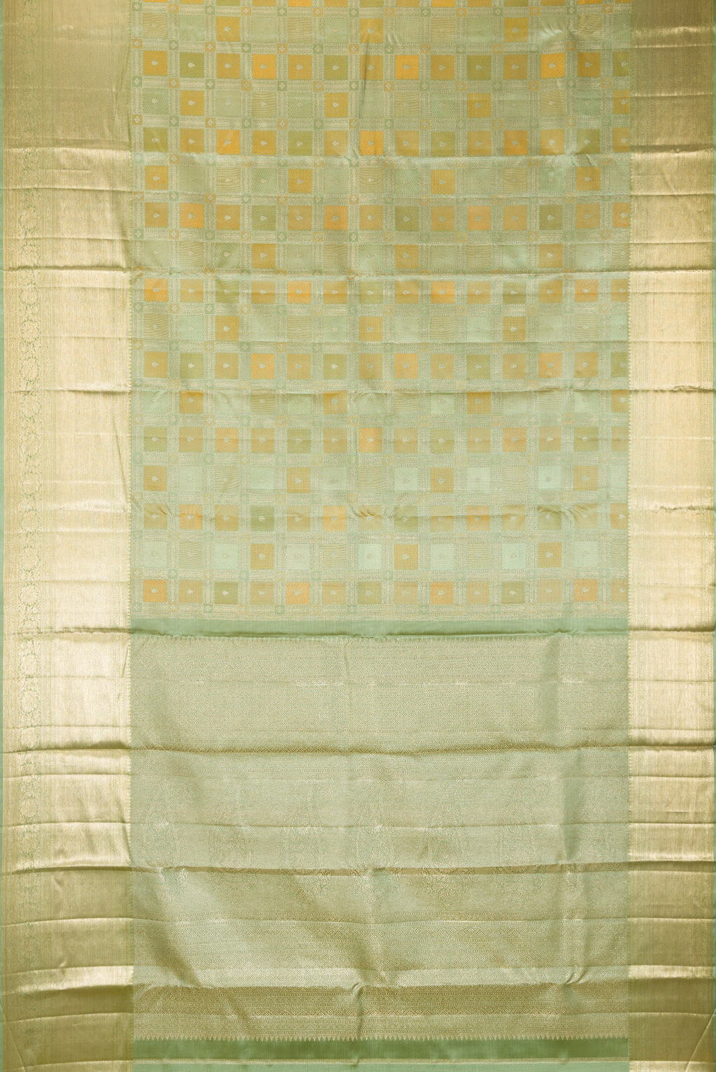 Flat view of Pure Silk Pista Green Kanjivaram Saree with Zari Brocade on the body and Zari Border. 
