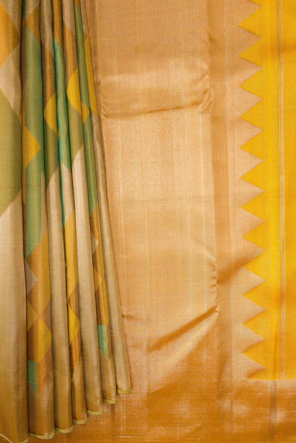 Pleats and pallu of Pure Silk Mustard Kanjivaram Saree with Zari Brocade on the body and Without Border. 