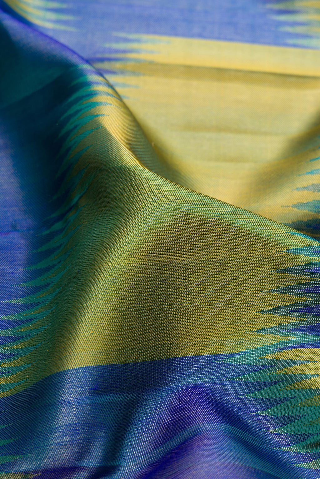 Close up of Pure Silk Multi Color Kanjivaram Saree with Zari Brocade on the body and Fancy Border.  displaying folds