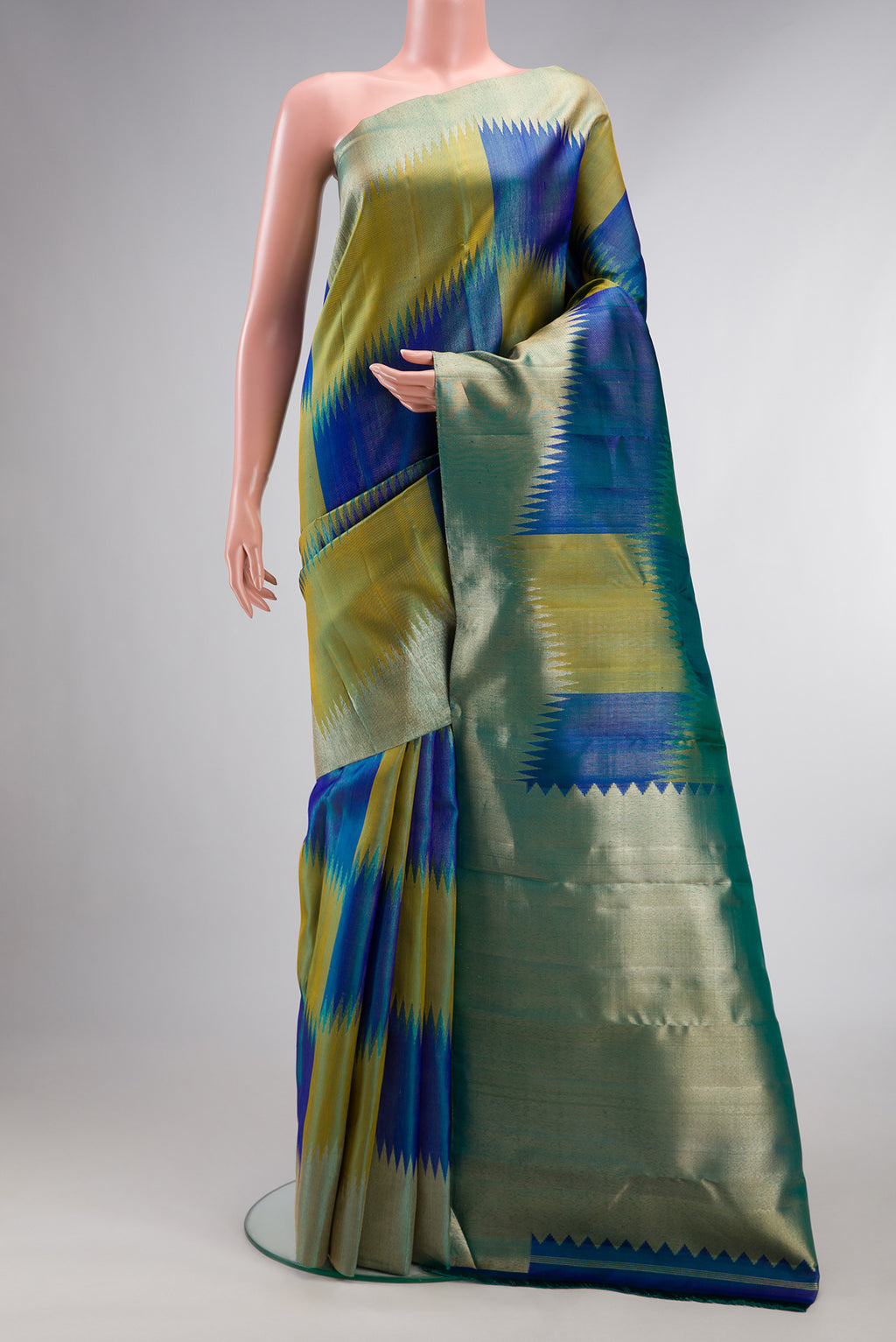 Pure Silk Multi Color Kanjivaram Saree with Zari Brocade on the body and Fancy Border.  displayed on a mannequin