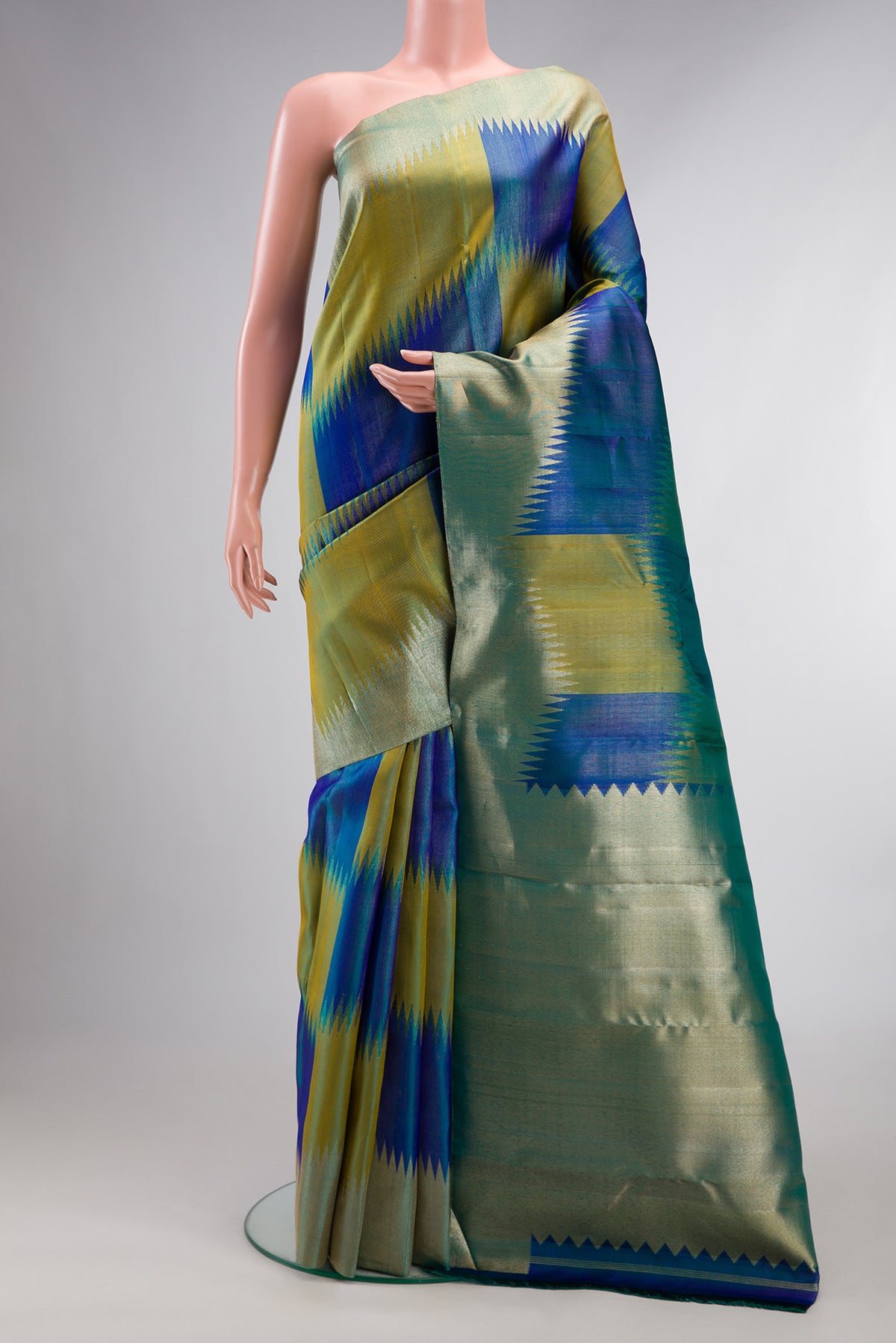 Pure Silk Multi Color Kanjivaram Saree with Zari Brocade on the body and Fancy Border.  displayed on a mannequin