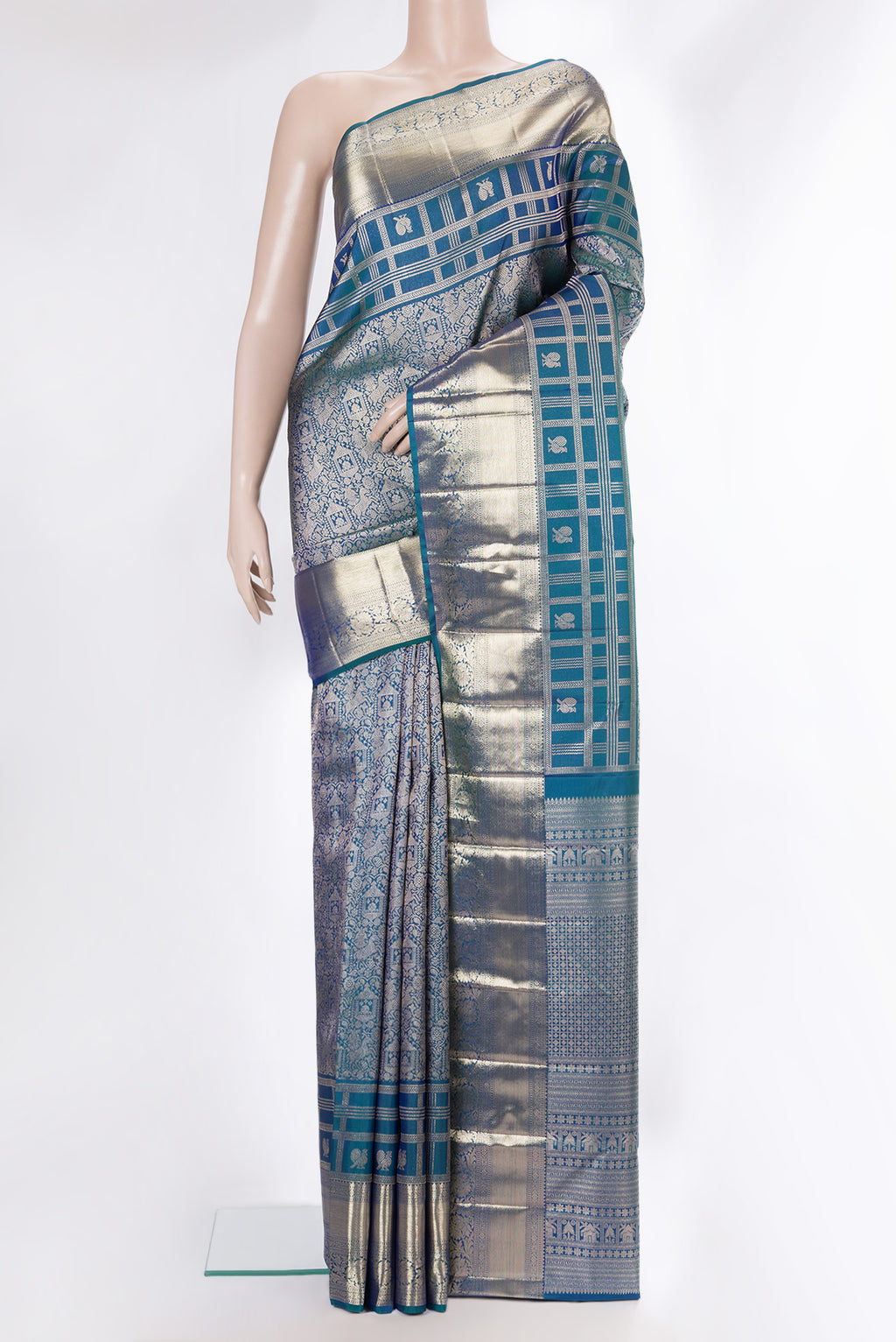Pure Silk Peacock Blue Dual Tone Kanjivaram Saree with Zari Brocade on the body and Zari Border.  displayed on a mannequin