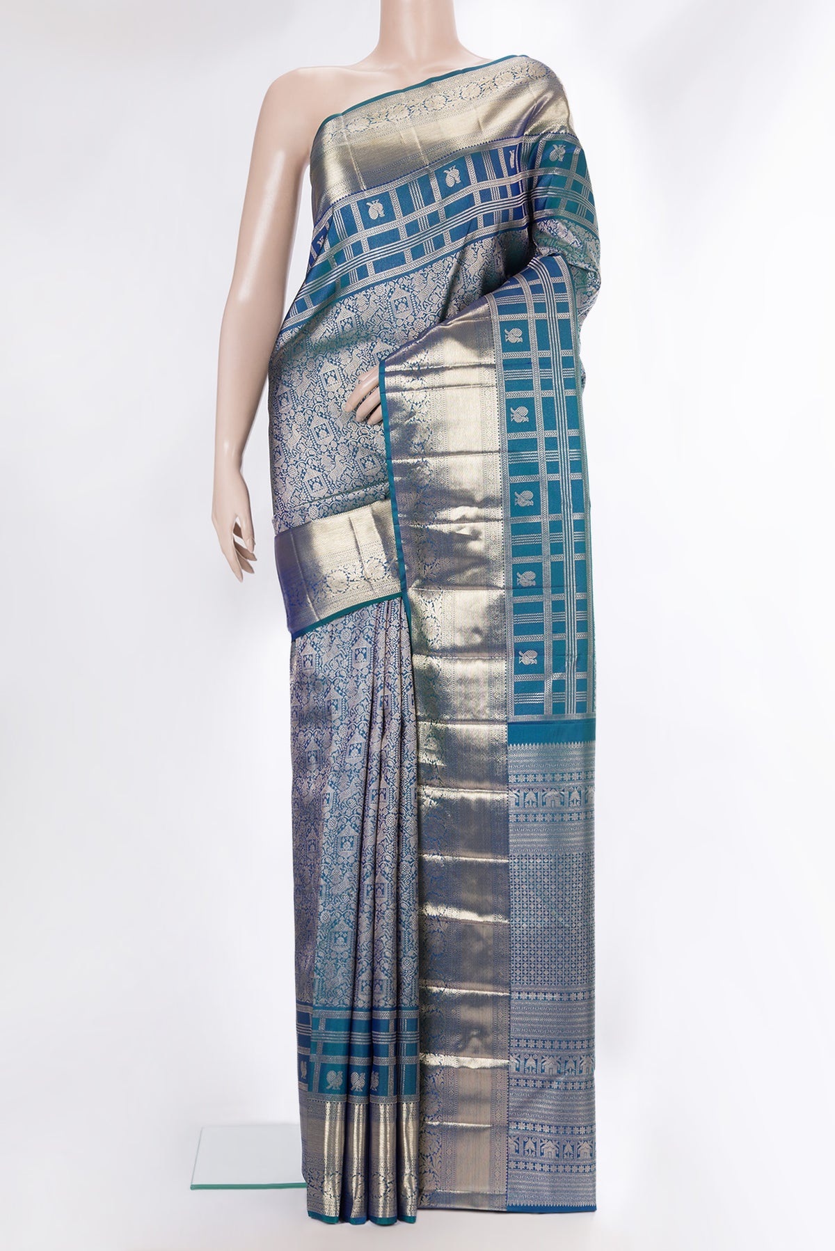 Pure Silk Peacock Blue Dual Tone Kanjivaram Saree with Zari Brocade on the body and Zari Border.  displayed on a mannequin