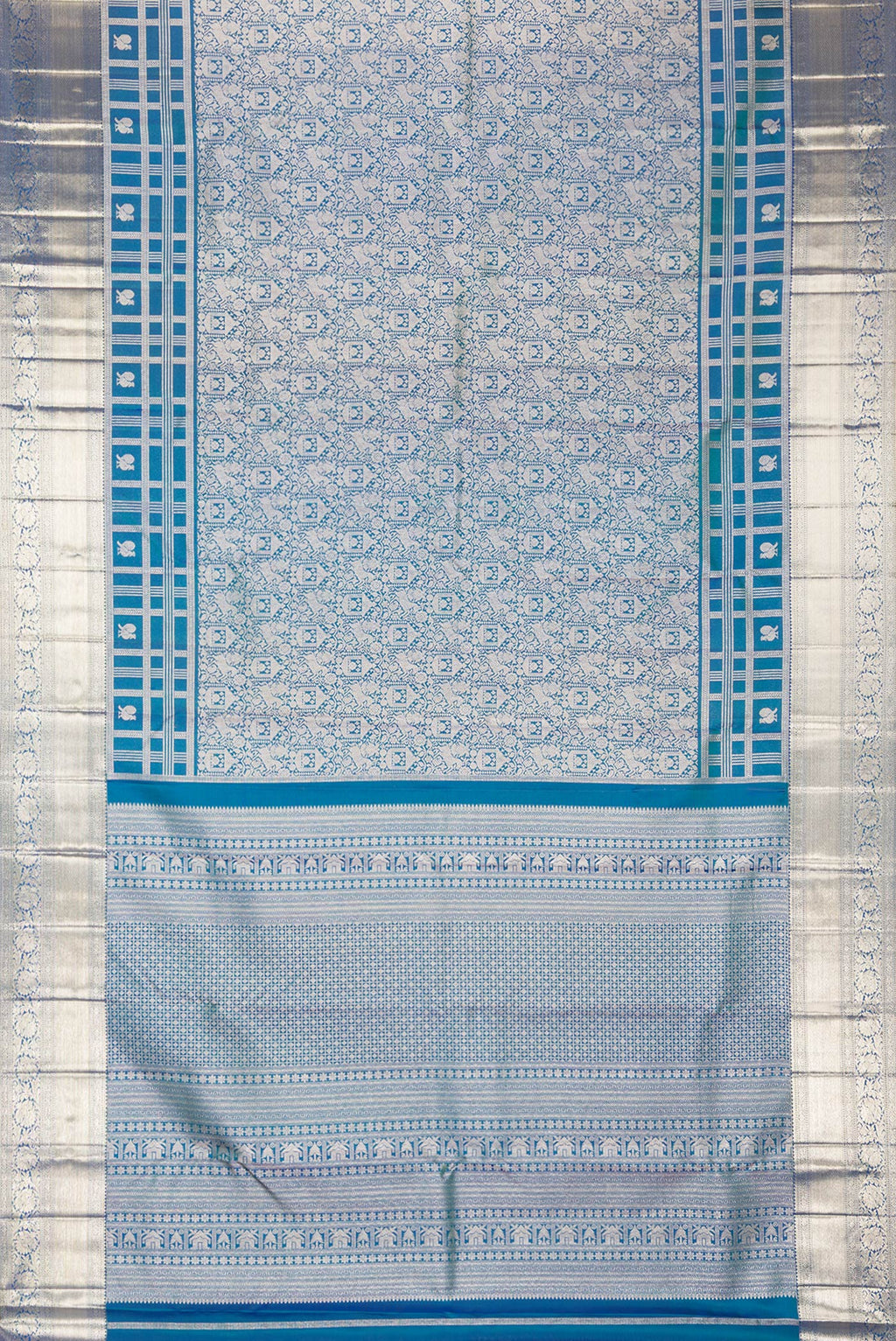 Flat view of Pure Silk Peacock Blue Dual Tone Kanjivaram Saree with Zari Brocade on the body and Zari Border. 