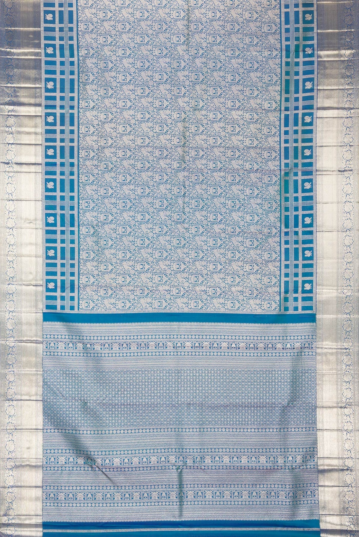 Flat view of Pure Silk Peacock Blue Dual Tone Kanjivaram Saree with Zari Brocade on the body and Zari Border. 