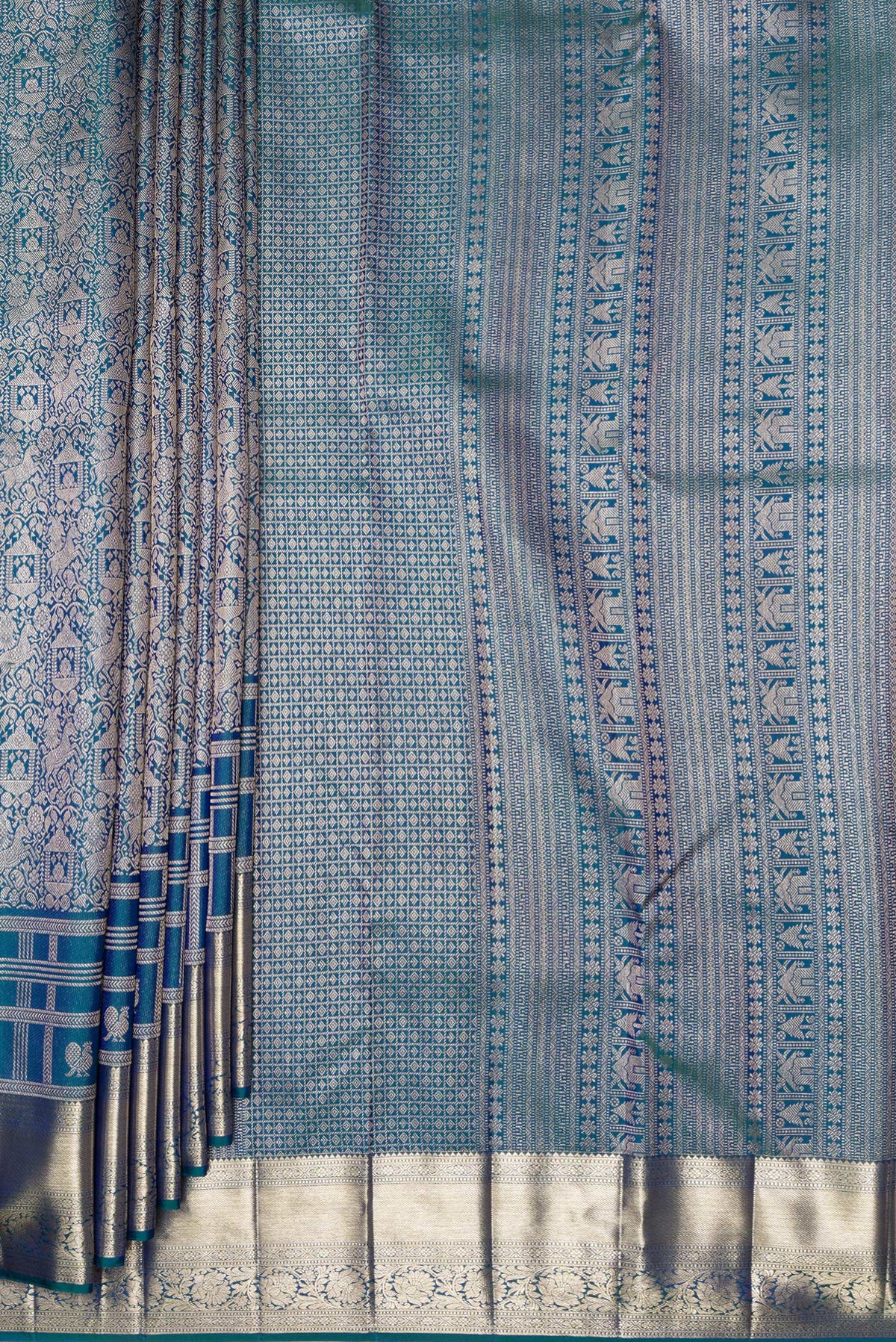 Pleats and pallu of Pure Silk Peacock Blue Dual Tone Kanjivaram Saree with Zari Brocade on the body and Zari Border. 