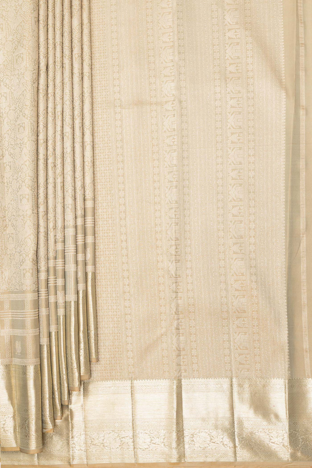 Pleats and pallu of Pure Silk Beige Kanjivaram Saree with Zari Brocade on the body and Fancy Border. 