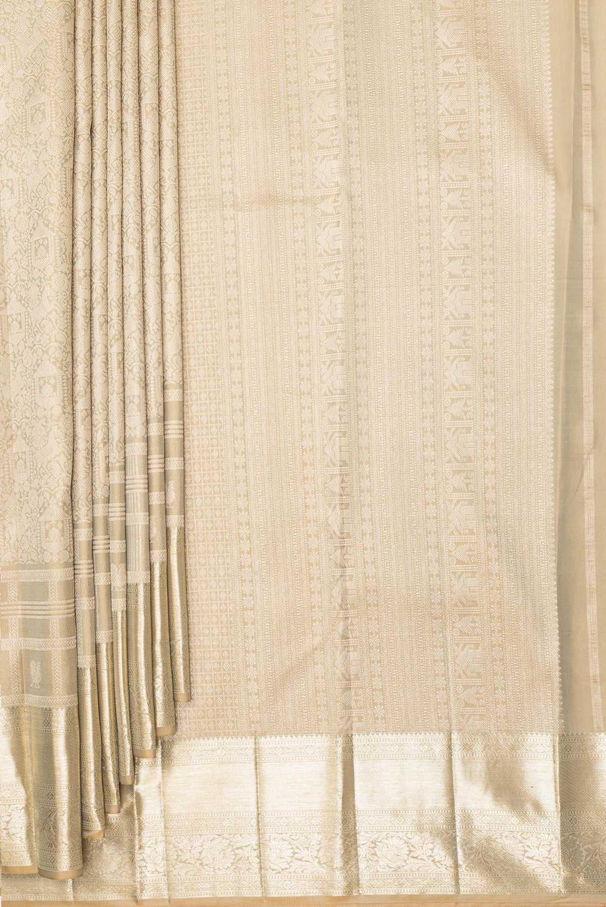 Pleats and pallu of Pure Silk Beige Kanjivaram Saree with Zari Brocade on the body and Fancy Border. 