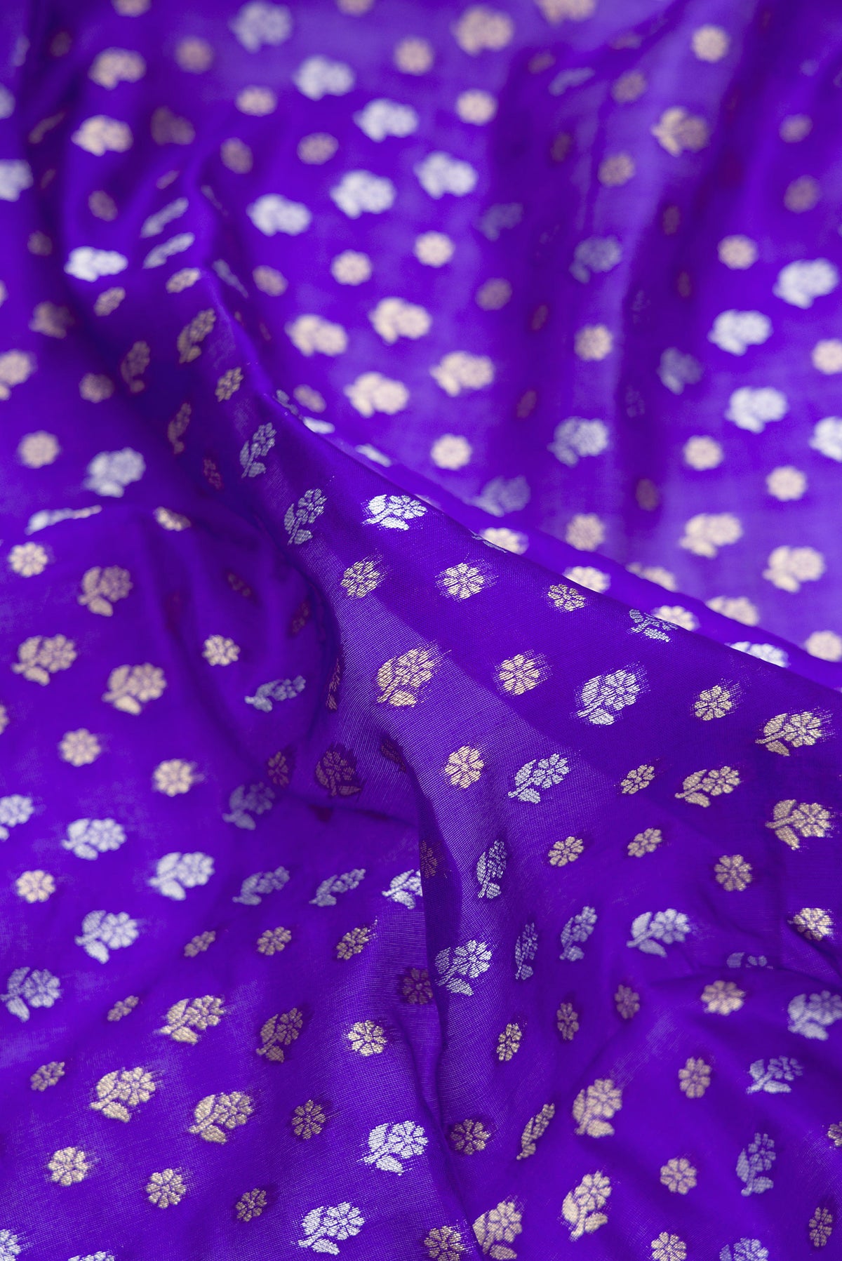 Close up of Pure Silk Royal Blue Dual Tone Banarasi Saree with Zari Brocade on the body and Zari Border.  displaying folds