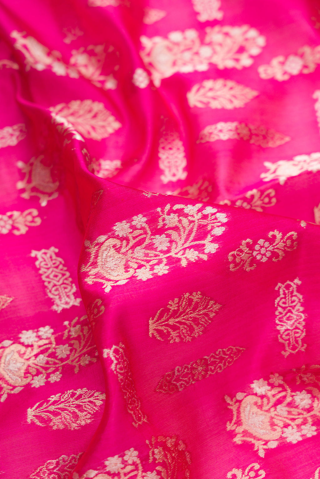 Close up of Pure Silk Pink Banarasi Saree with Zari Brocade on the body and Zari Border.  displaying folds