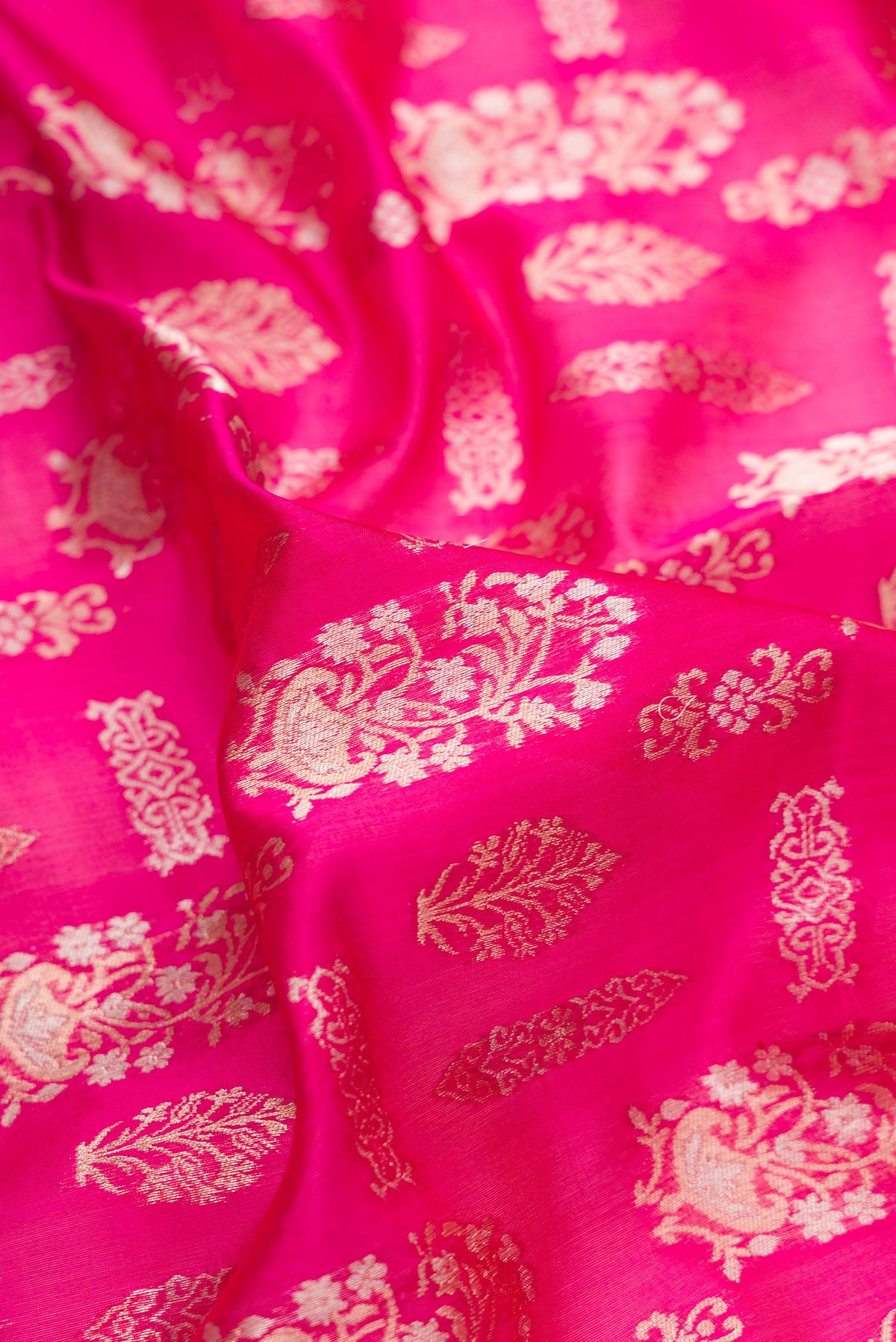 Close up of Pure Silk Pink Banarasi Saree with Zari Brocade on the body and Zari Border.  displaying folds