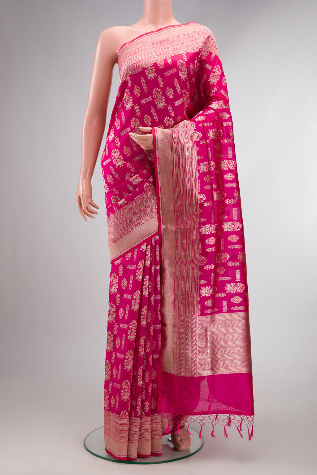 Pure Silk Pink Banarasi Saree with Zari Brocade on the body and Zari Border.  displayed on a mannequin