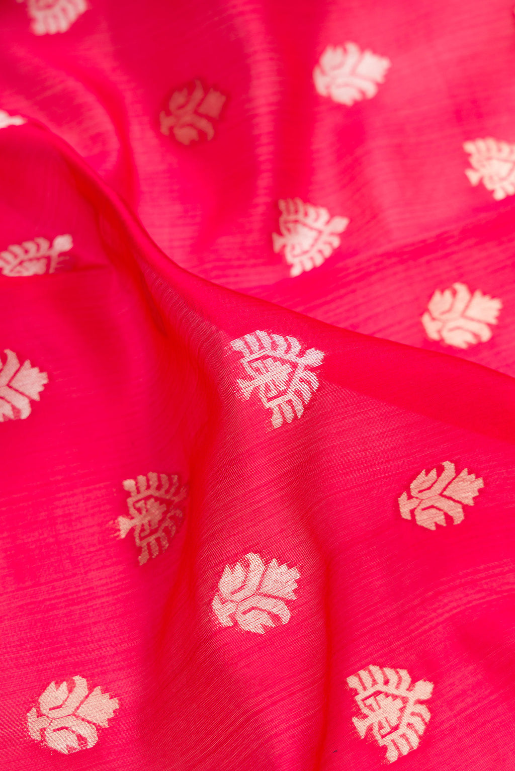 Close up of Pure Silk Red Dual Tone Banarasi Saree with Zari Butta on the body and Zari Border.  displaying folds
