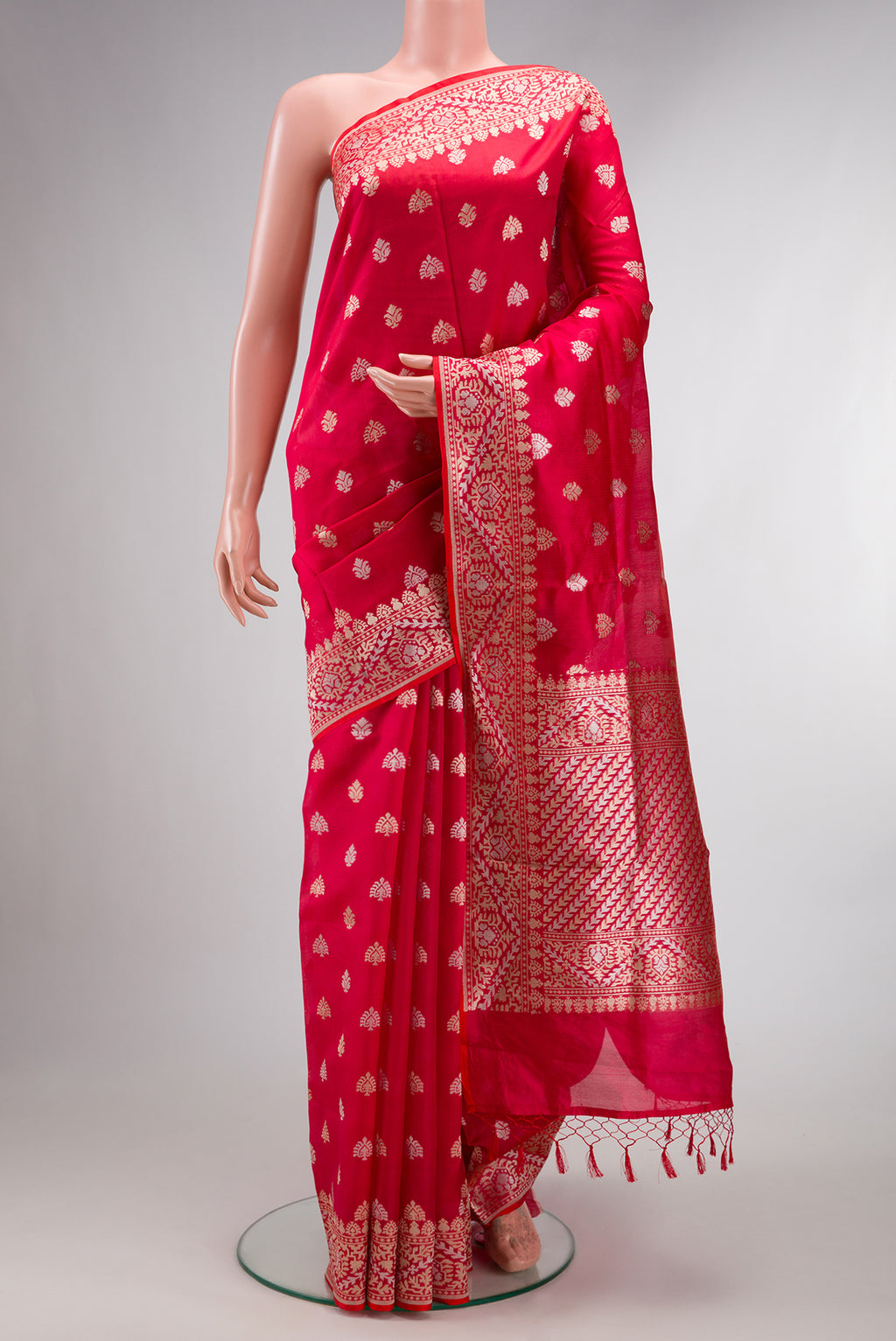 Pure Silk Red Dual Tone Banarasi Saree with Zari Butta on the body and Zari Border.  displayed on a mannequin