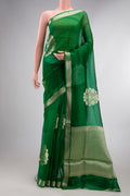 Green Organza Saree with Zari Butta on the body and Zari Border.  displayed on a mannequin