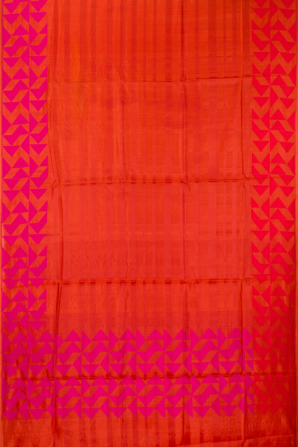 Flat view of Orange Tussar Saree with Stripes on the body and Fancy Border. 