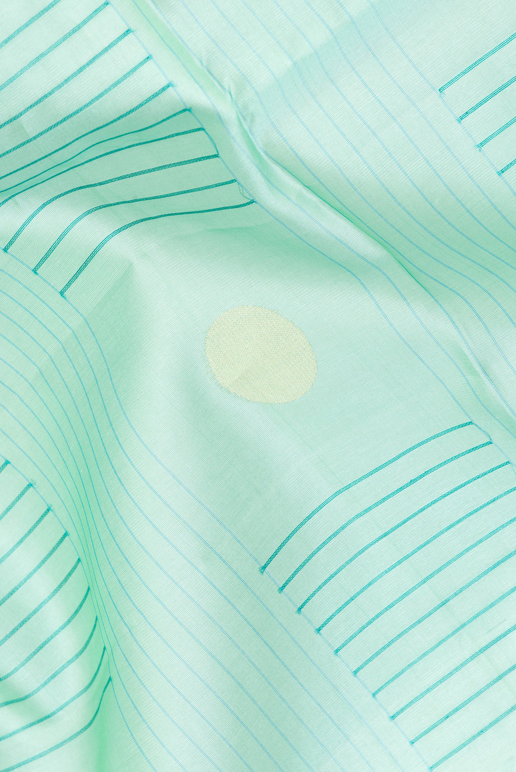 Close up of Pure Silk Sea Green Dual Tone Tussar Saree with Stripes on the body and Zari Border.  displaying folds