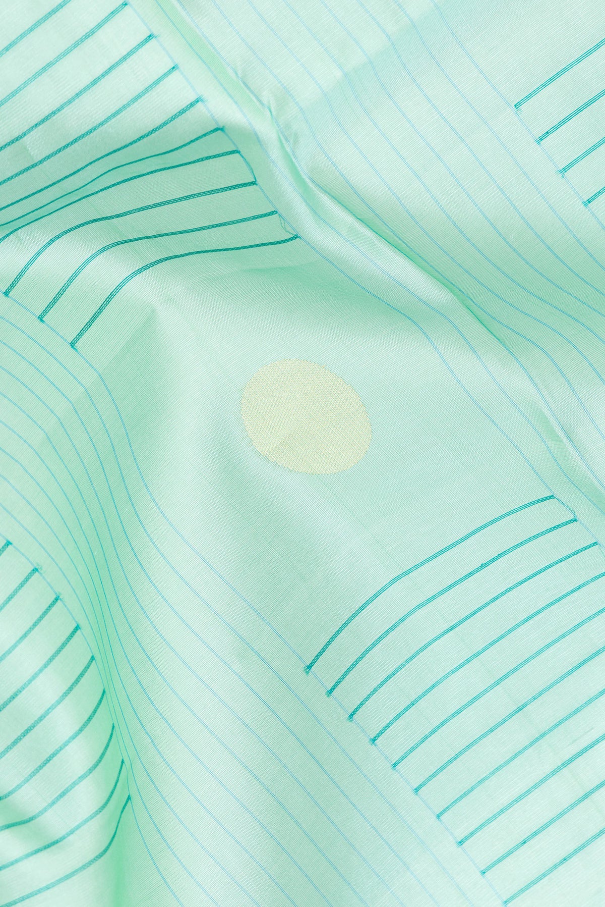 Close up of Pure Silk Sea Green Dual Tone Tussar Saree with Stripes on the body and Zari Border.  displaying folds