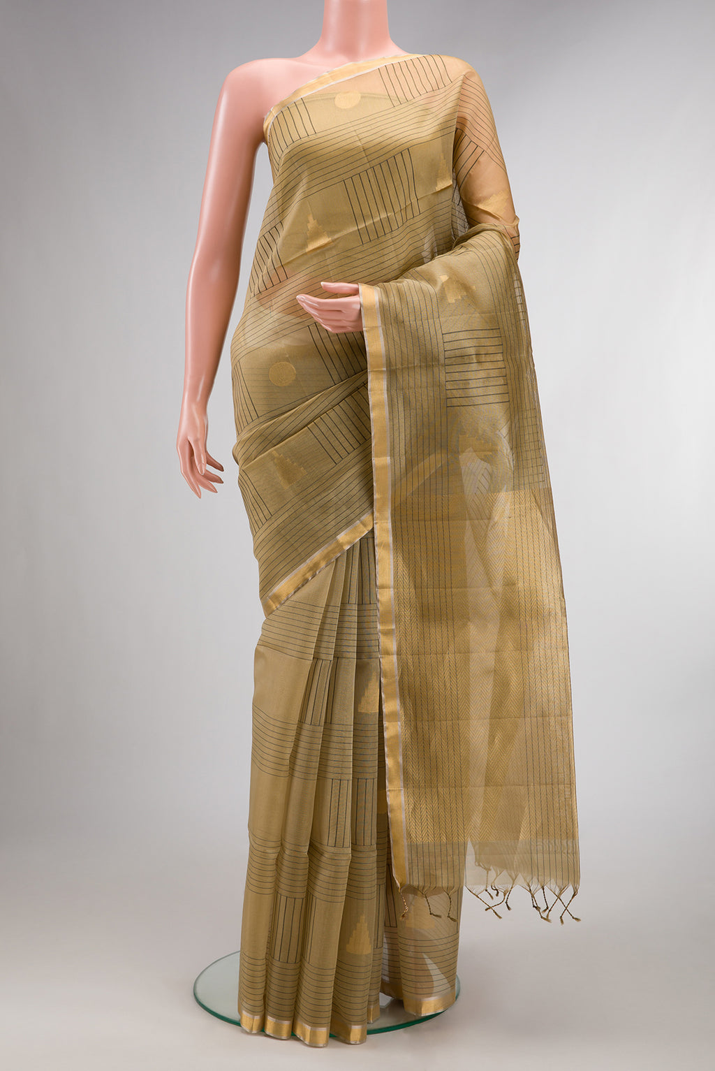 Pure Silk Beige Soft Saree with Checked design on the body and Zari Border.  displayed on a mannequin