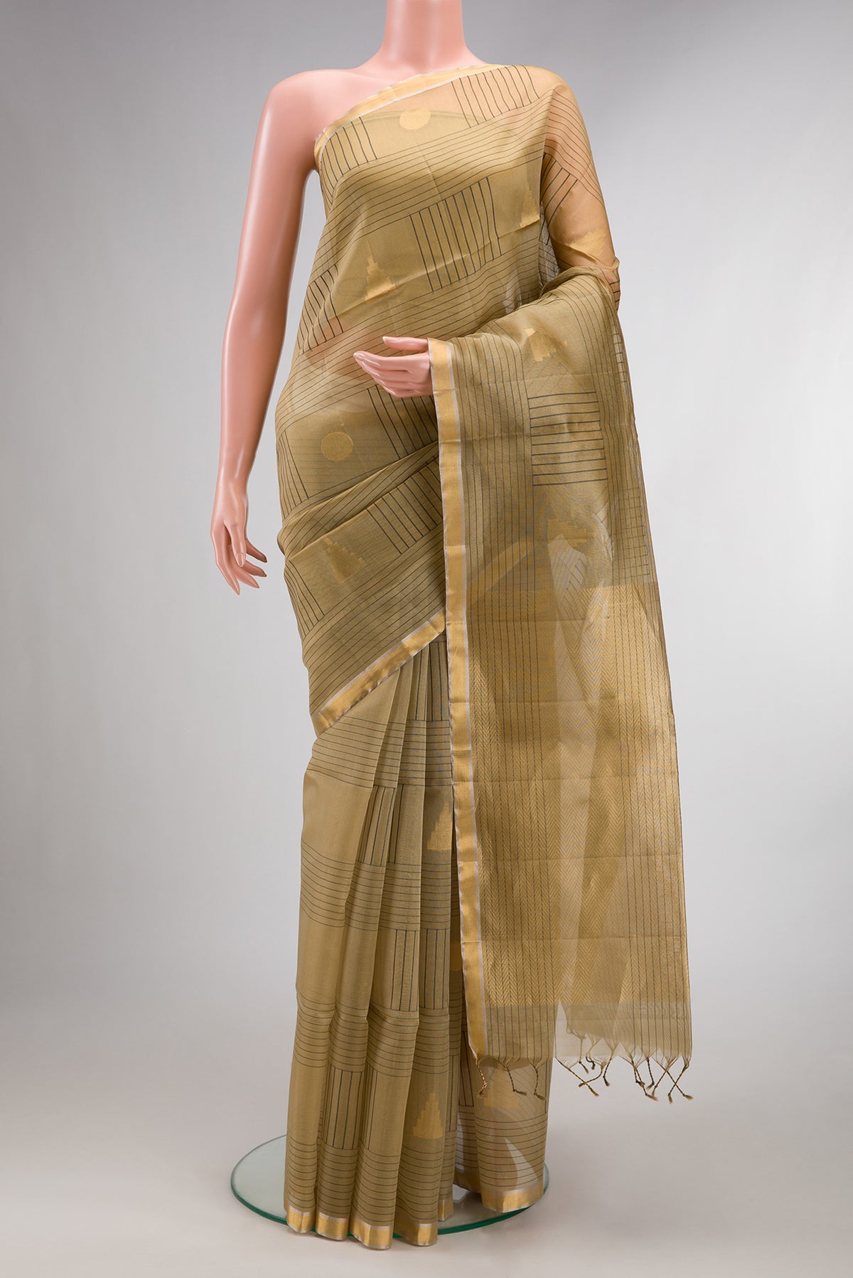 Pure Silk Beige Soft Saree with Checked design on the body and Zari Border.  displayed on a mannequin