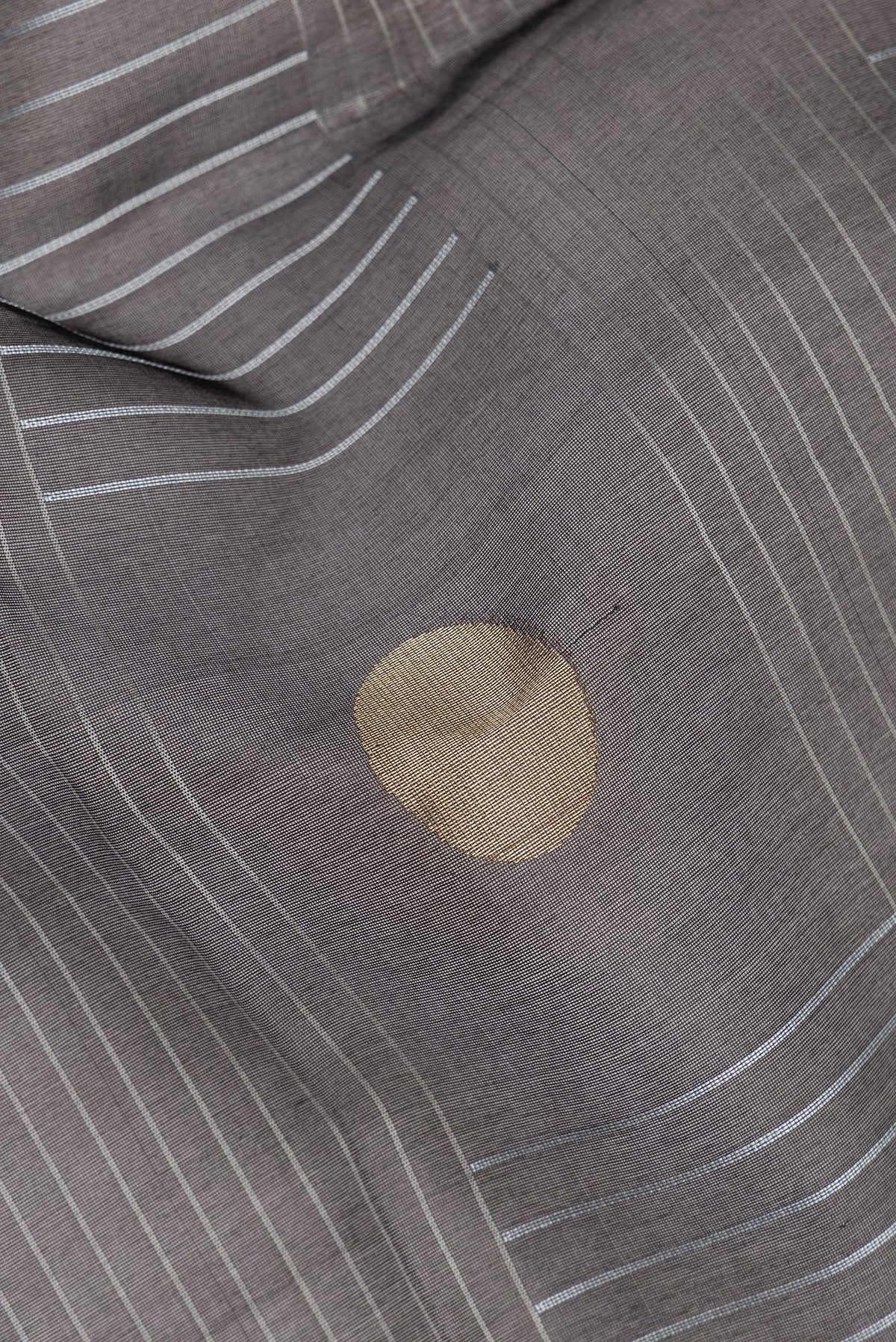 Close up of Pure Silk Black Tussar Saree with Stripes on the body and Zari Border.  displaying folds