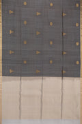 Pure Silk Black Tussar Saree with Stripes on the body and Zari Border.  displayed on a mannequin
