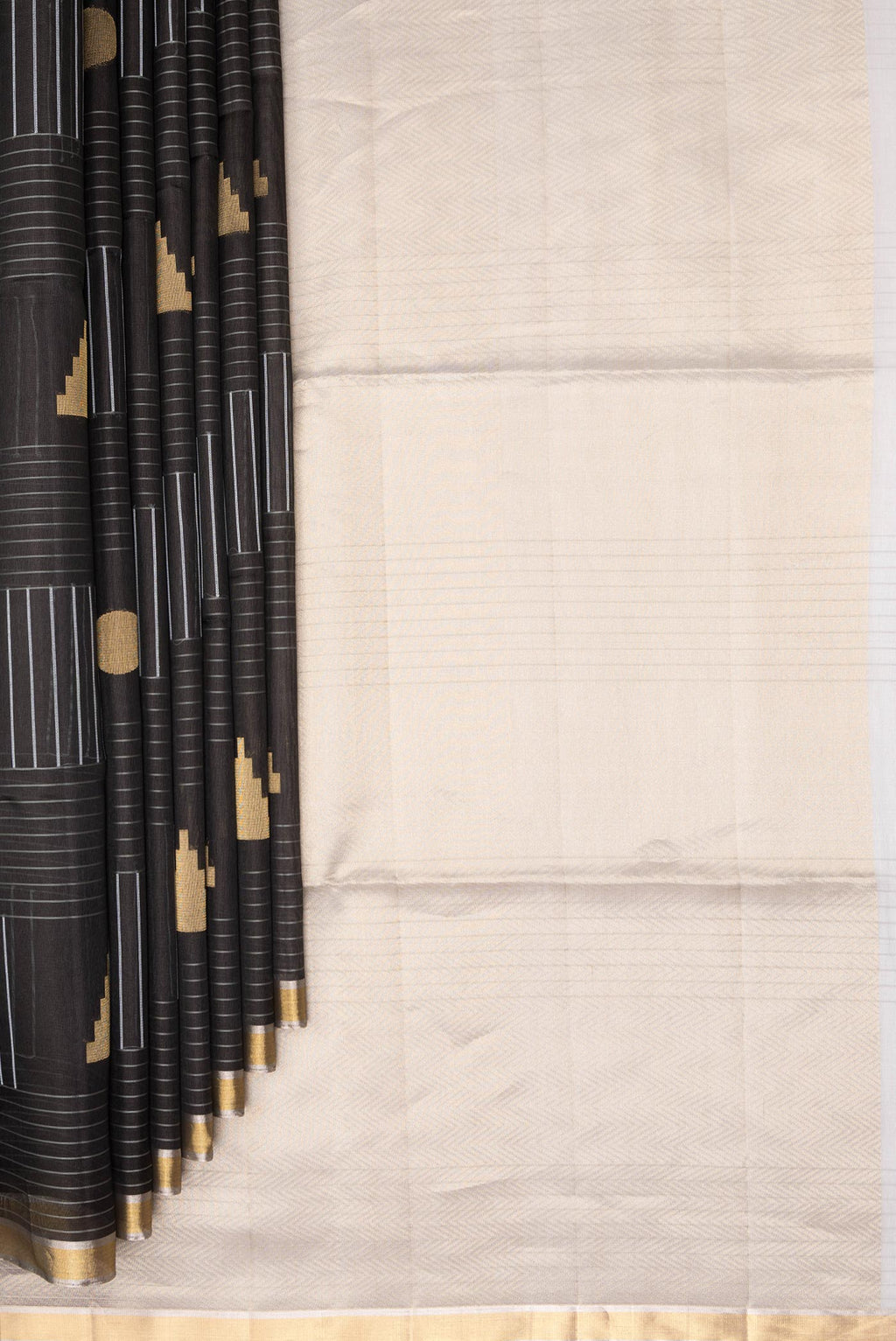 Pleats and pallu of Pure Silk Black Tussar Saree with Stripes on the body and Zari Border. 