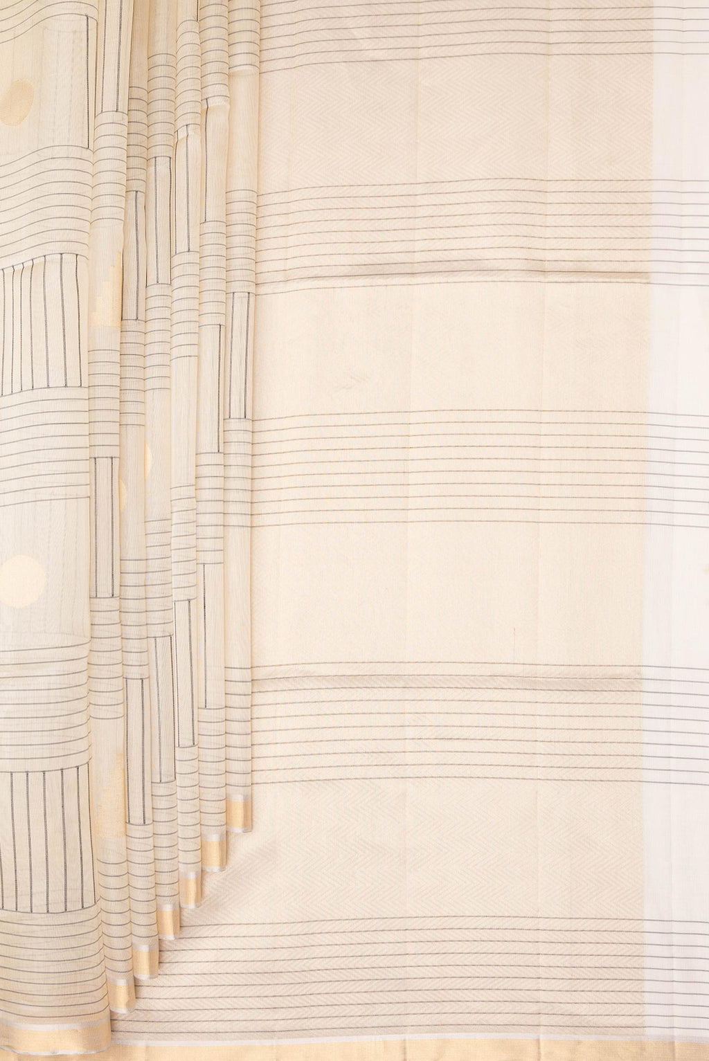 Pleats and pallu of Cream Tussar Saree with Stripes on the body and Zari Border. 