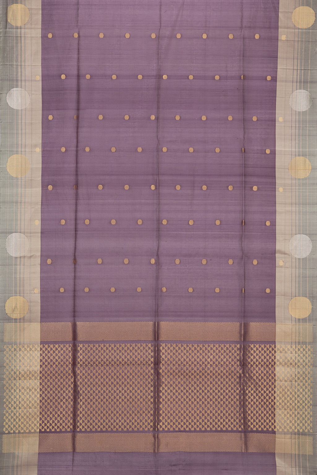 Flat view of Mauve Tussar Saree with Zari Butta on the body and Zari Border. 