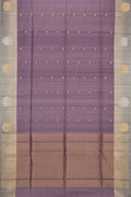 Mauve Tussar Saree with Zari Butta on the body and Zari Border.  displayed on a mannequin