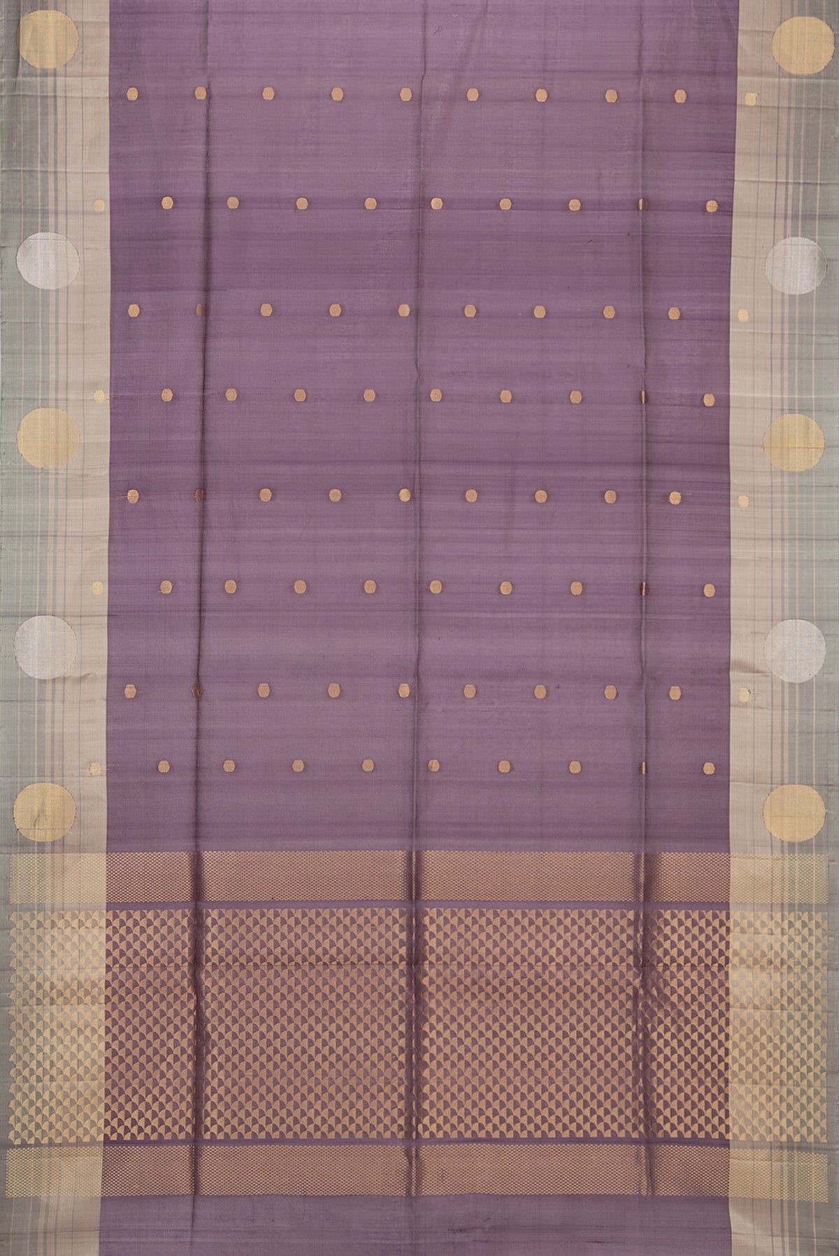 Mauve Tussar Saree with Zari Butta on the body and Zari Border.  displayed on a mannequin