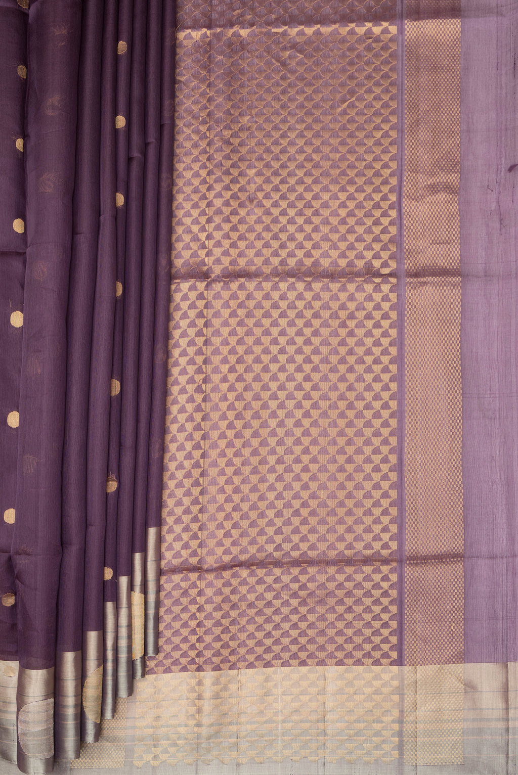 Pleats and pallu of Mauve Tussar Saree with Zari Butta on the body and Zari Border. 