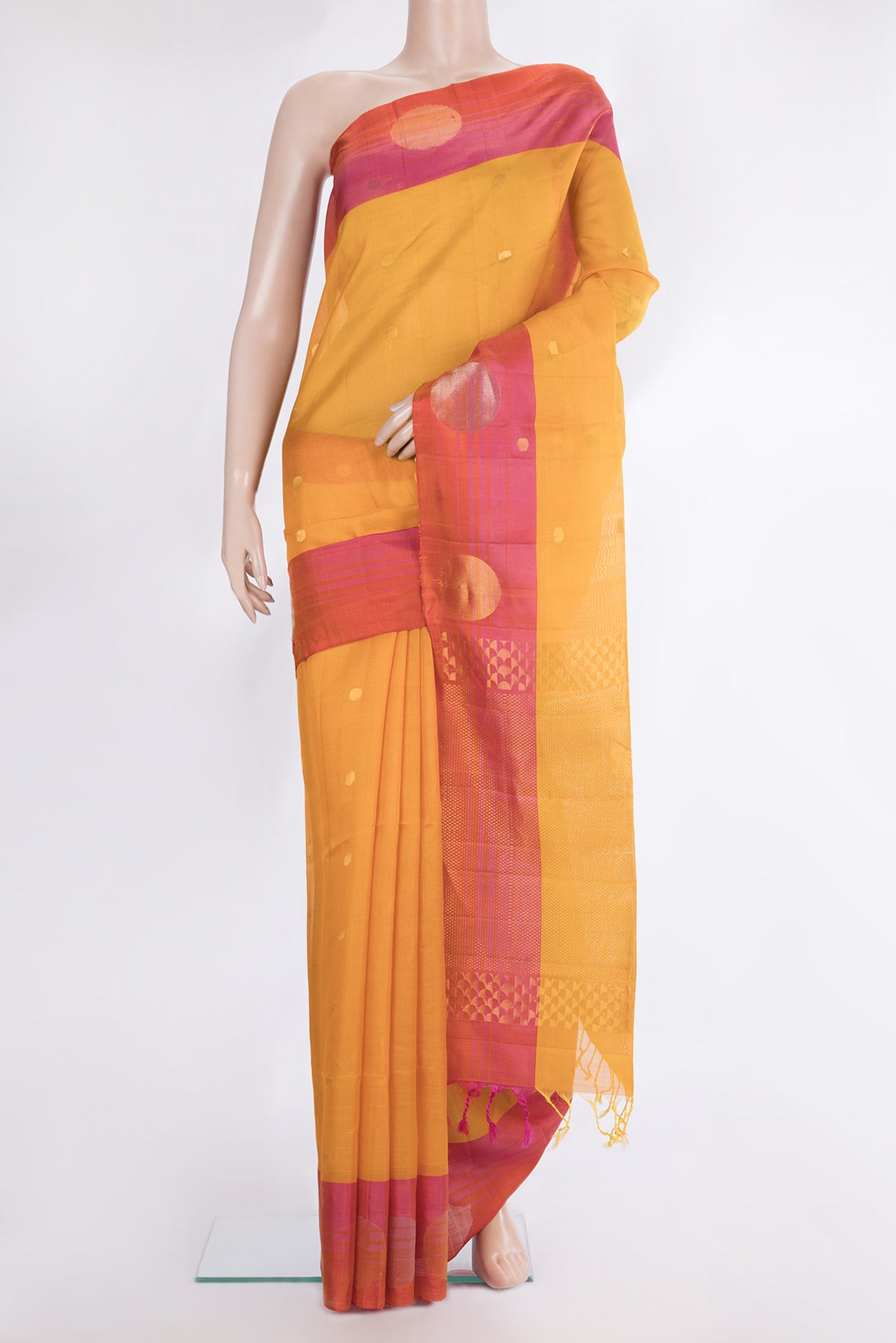 Pure Silk Mustard Dual Tone Tussar Saree with Zari Butta on the body and Zari Border.  displayed on a mannequin