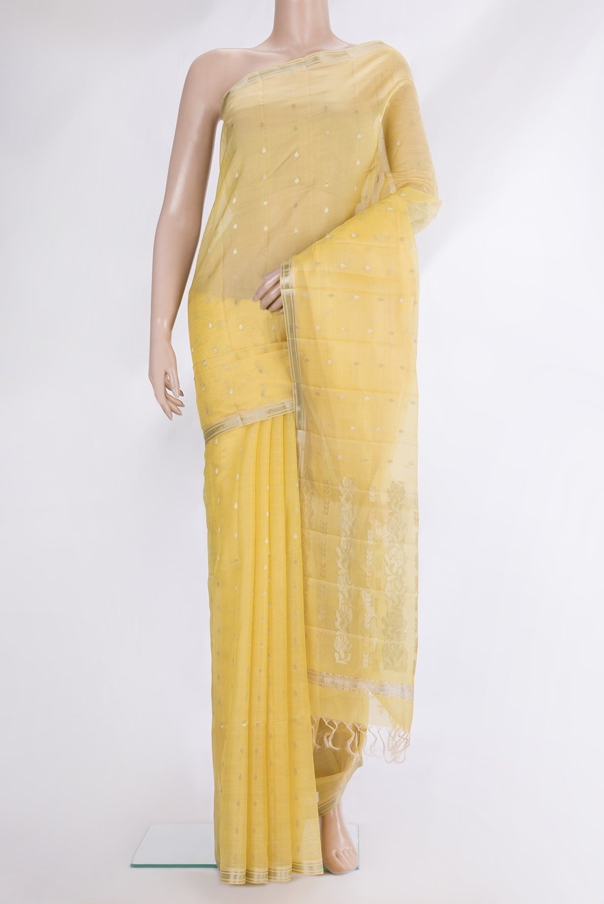 Pure Silk Yellow Dual Tone Tussar Saree with Zari Butta on the body and Zari Border.  displayed on a mannequin
