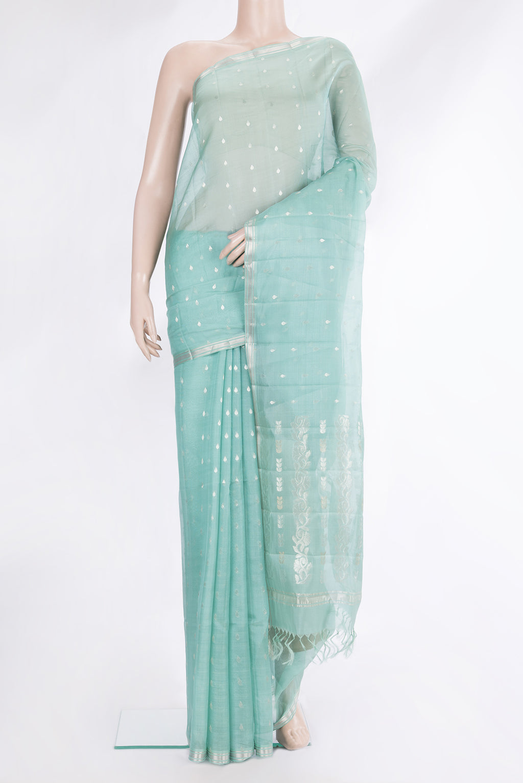 Light Blue Tussar Saree with Zari Butta on the body and Zari Border.  displayed on a mannequin